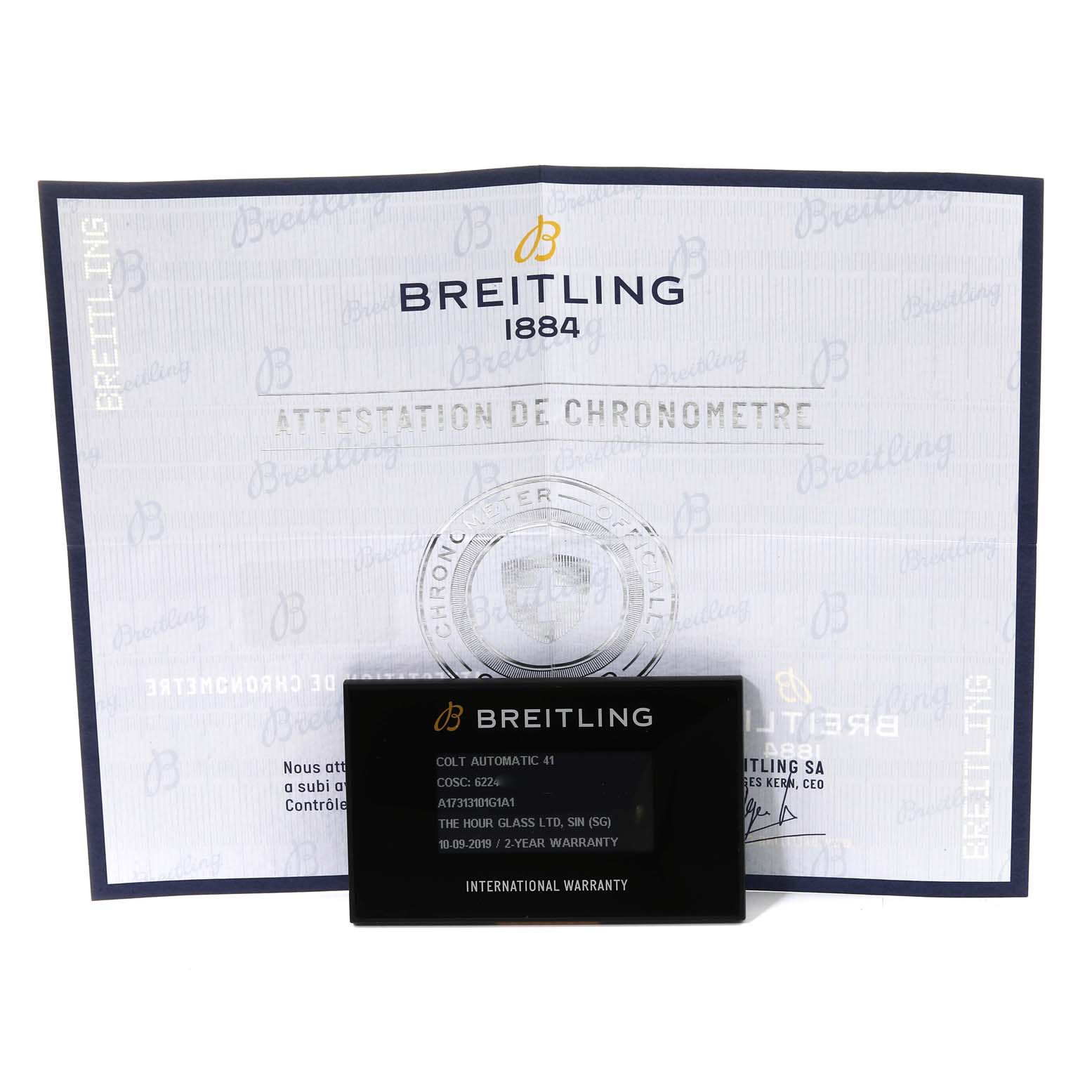 This image shows a certificate and international warranty card for a Breitling Colt A17313 Men
s Stainless Steel White Dial A17313 Men
s Stainless Steel White Dial model.