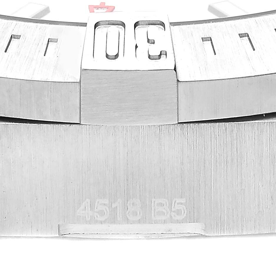 This image shows a close-up of the bezel and part of the case of a Breitling Colt A17313 Men
s Stainless Steel White Dial A17313 Men
s Stainless Steel White Dial watch.