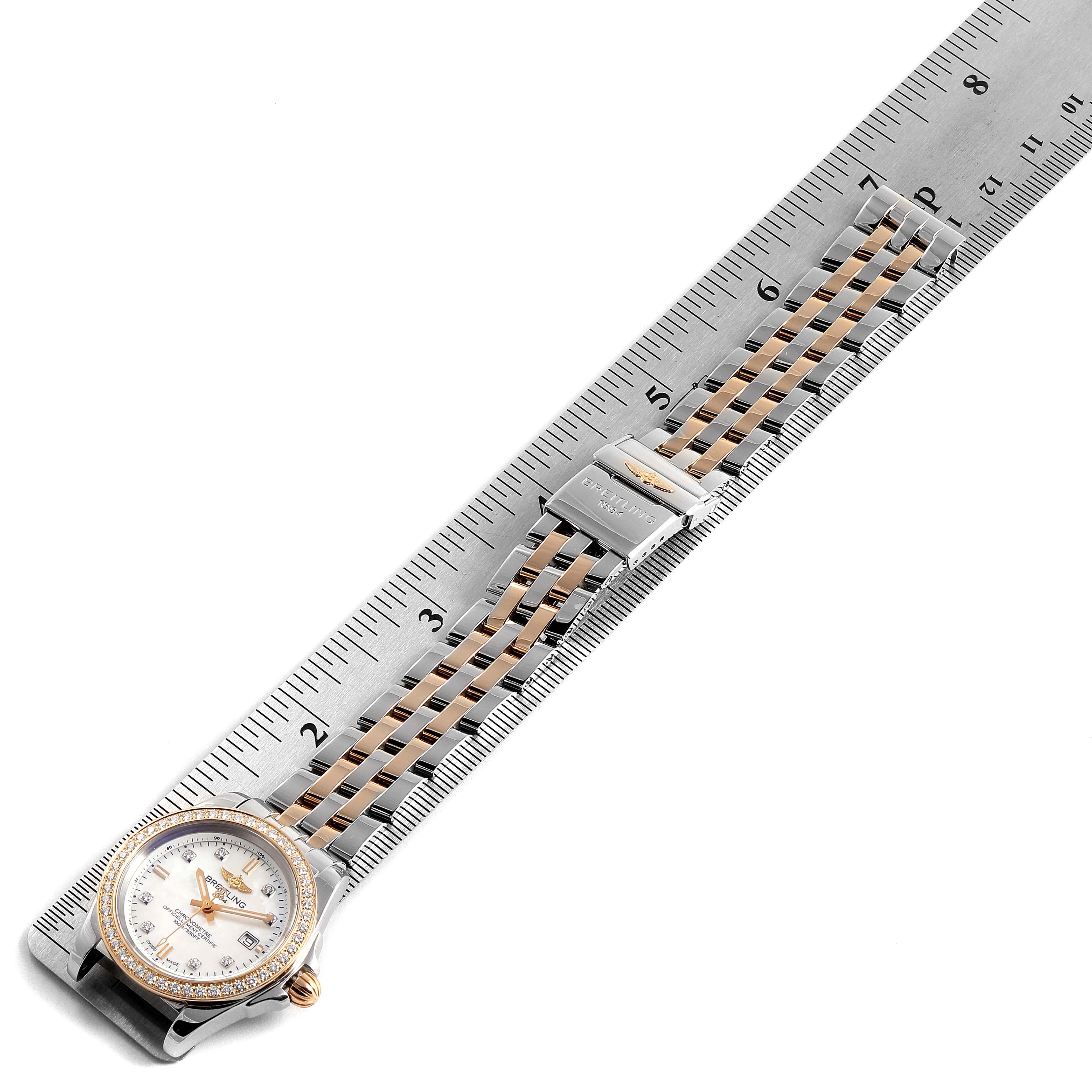 The Breitling C7133053/A803-792C Women's Steel and Gold (two tone) Mother of Pearl Dial C7133053/A803-792C Women's Steel and Gold (two tone) Mother of Pearl Dial Galactic 32 Steel Rose Gold MOP Diamond Ladies Watch C71330 is shown from a top-down angle, displaying its face and band.