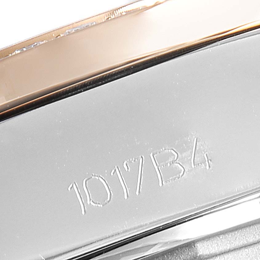 This image shows a close-up of the engraved serial number and part of the bezel of the Breitling C7133053/A803-792C Women's Steel and Gold (two tone) Mother of Pearl Dial C7133053/A803-792C Women's Steel and Gold (two tone) Mother of Pearl Dial Galactic 32 Steel Rose Gold MOP Diamond Ladies Watch, model C71330.