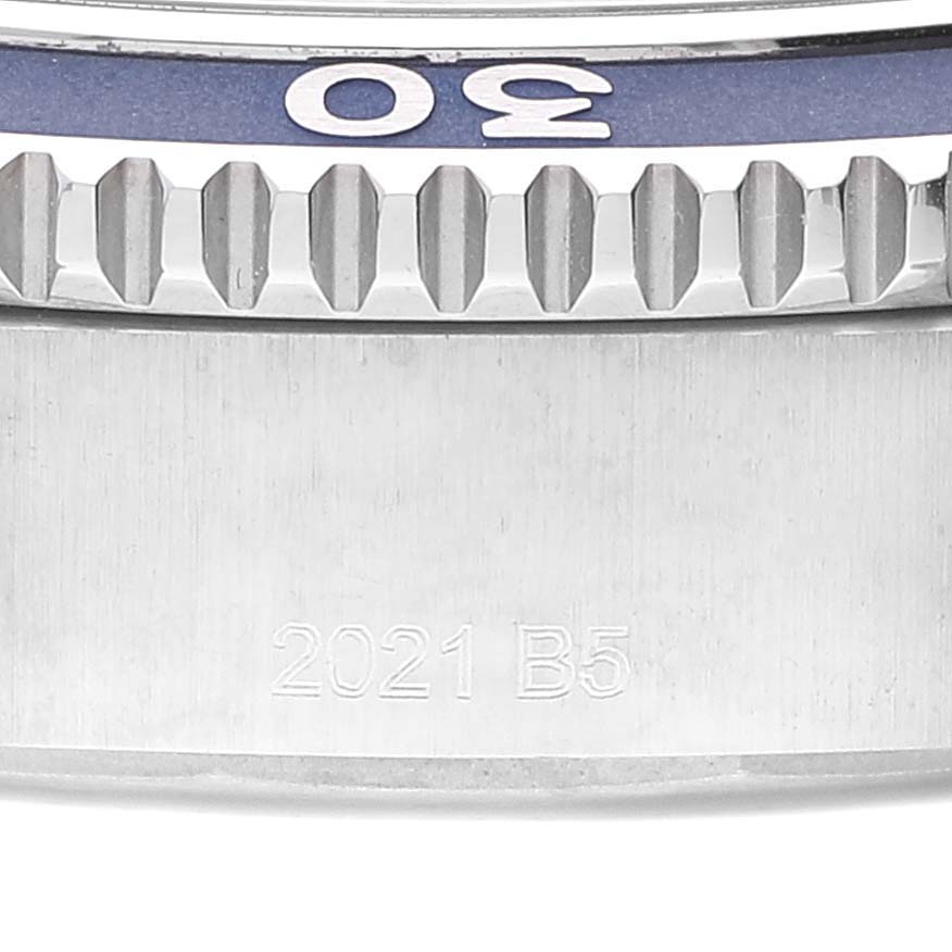 This close-up angle of the Breitling Superocean A17366 Men
s Stainless Steel Blue Dial A17366 Men
s Stainless Steel Blue Dial watch shows the bezel with 30 marking and part of the side case with the engraving "2021 B5."