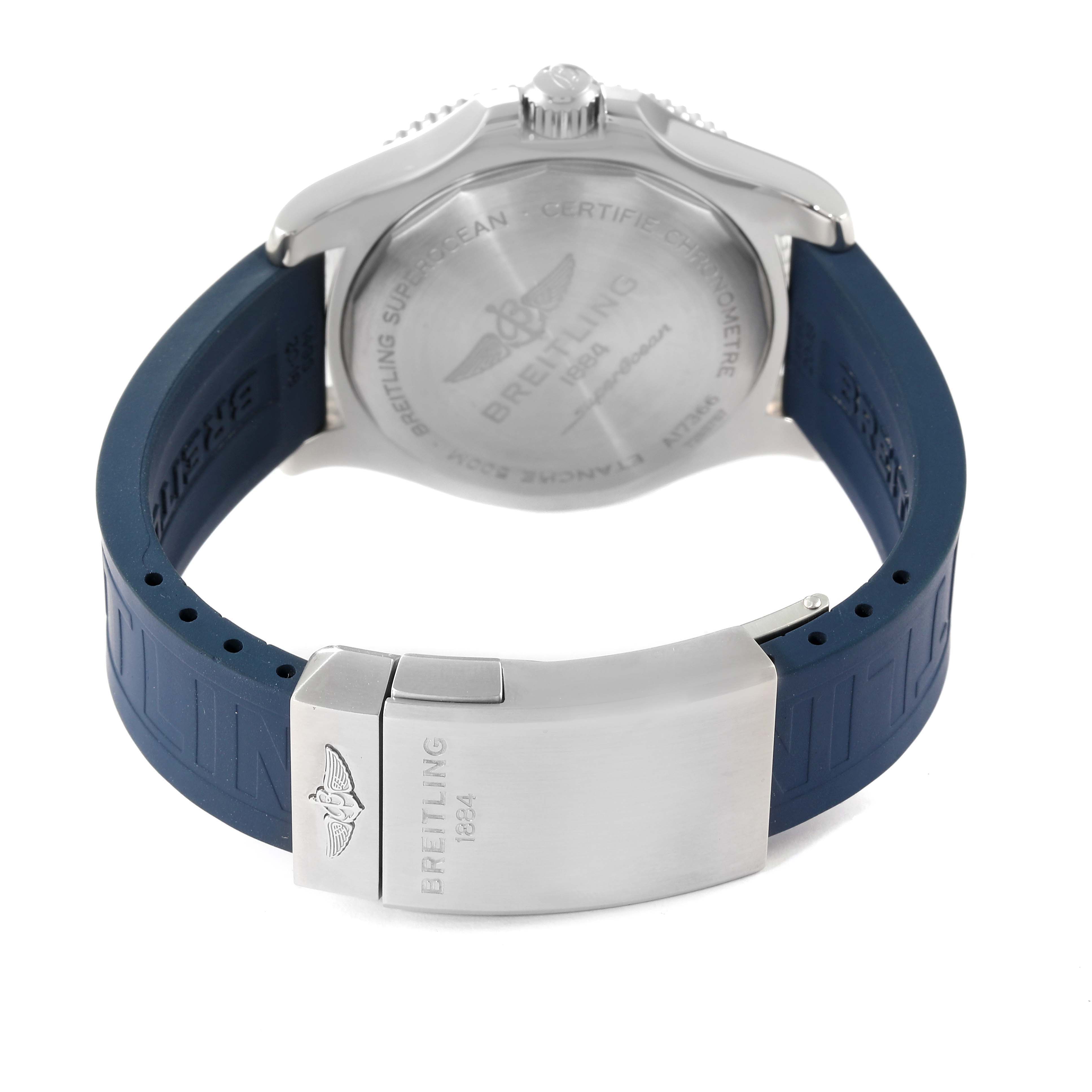 The image shows the back view of a Breitling Superocean A17366 Men
s Stainless Steel Blue Dial A17366 Men
s Stainless Steel Blue Dial watch, focusing on the case back and the clasp of the blue rubber strap.