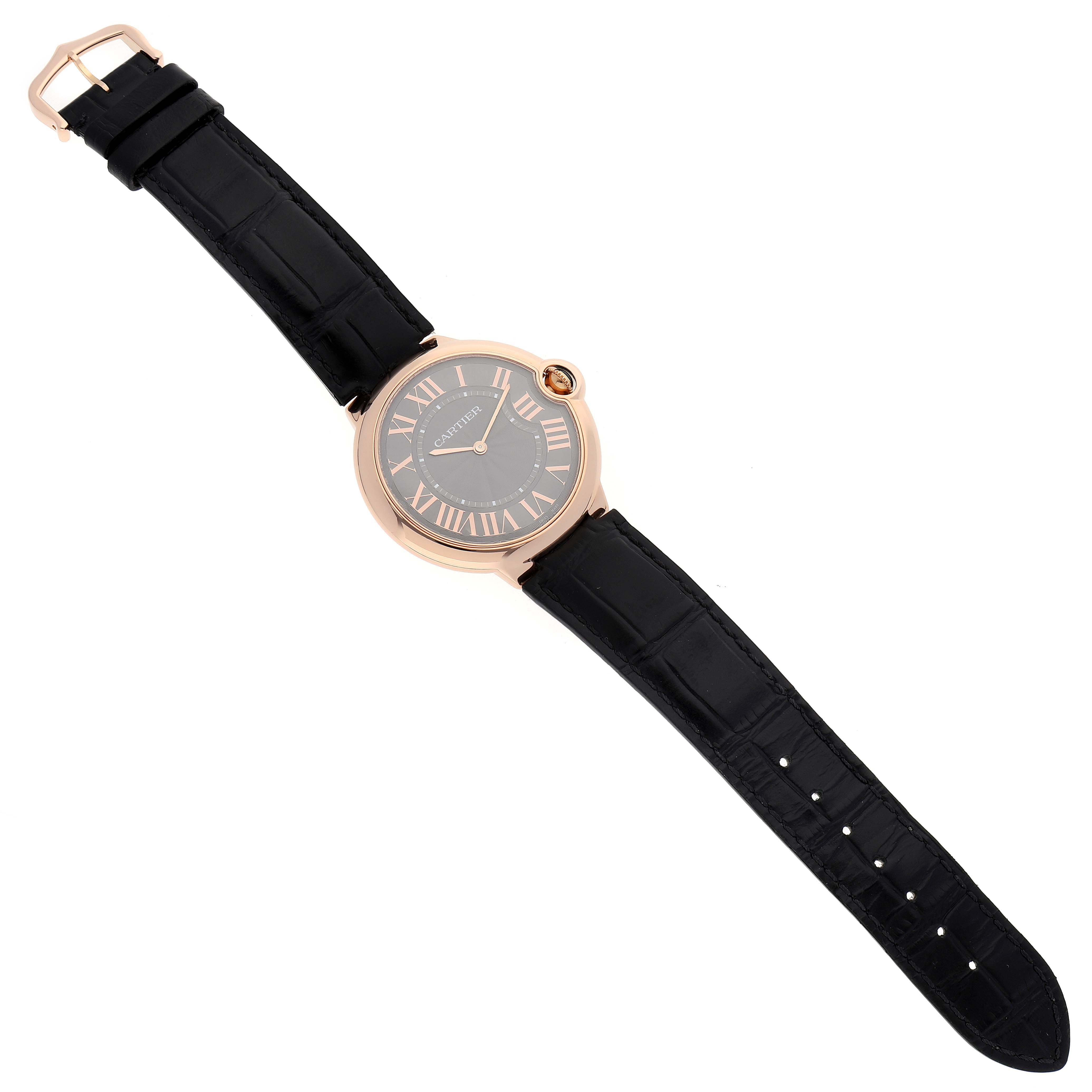 The image shows a top view of a Cartier Ballon Bleu W6920089 Men's Rose Gold Grey Dial W6920089 Men's Rose Gold Grey Dial watch, displaying the face, strap, and buckle.