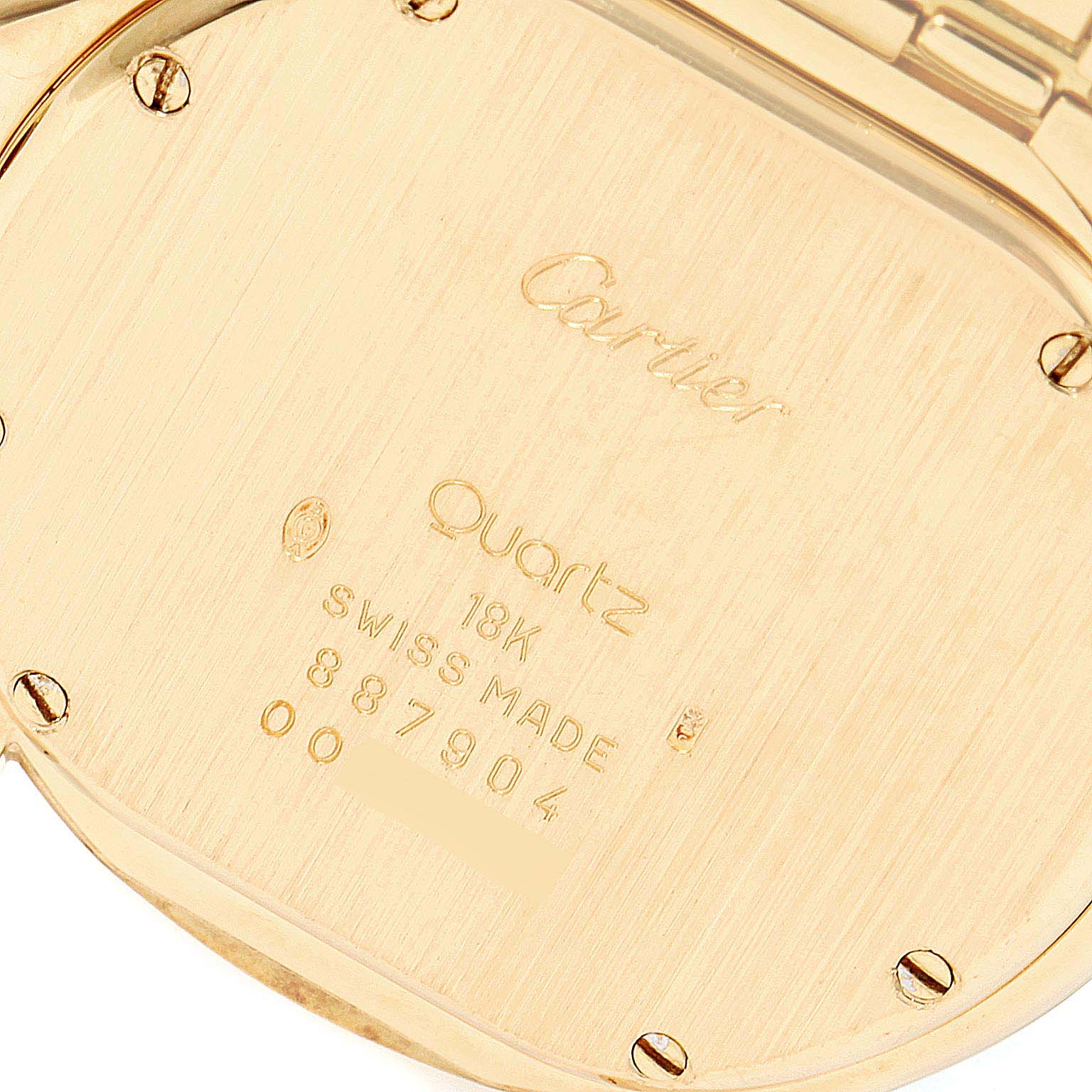The image shows the back case of a Cartier Panthere 887904 Men's Yellow Gold Silver Dial 887904 Men's Yellow Gold Silver Dial watch, highlighting its markings and material details.