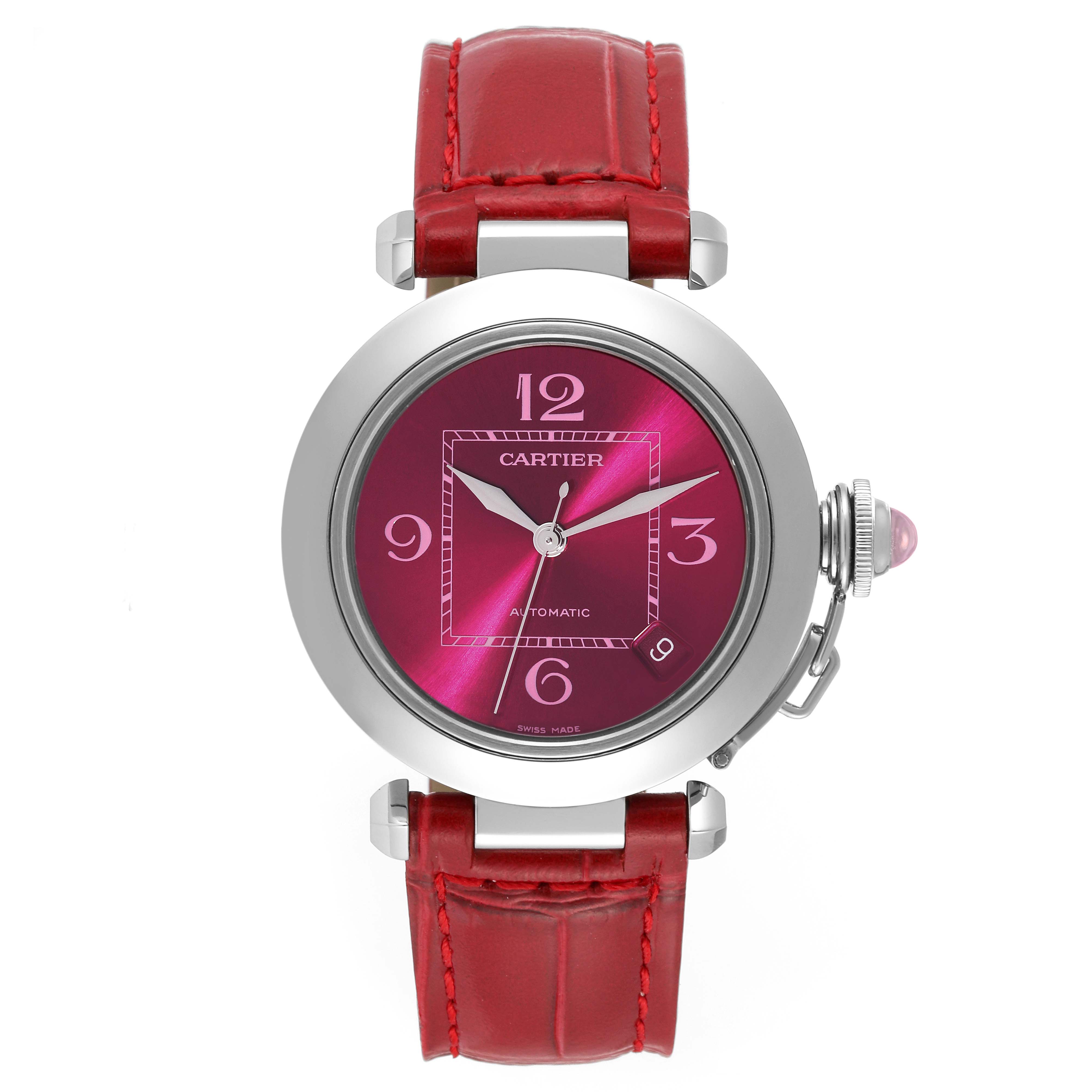 This image shows a Cartier Pasha W3108299 Women's Stainless Steel Pink Dial W3108299 Women's Stainless Steel Pink Dial watch from a front angle, displaying its red dial, leather strap, and crown.