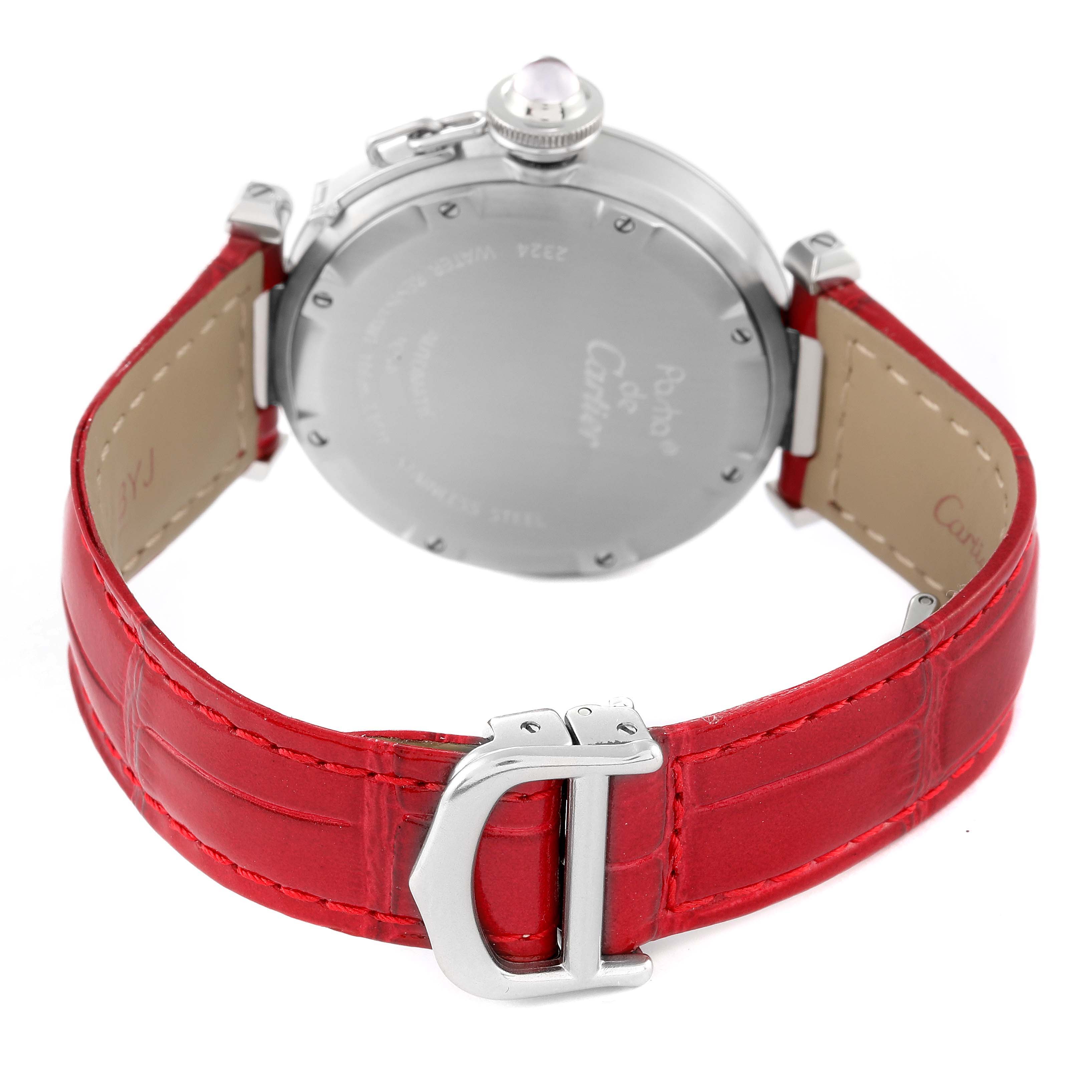The image shows the back casing and red leather strap of a Cartier Pasha W3108299 Women's Stainless Steel Pink Dial W3108299 Women's Stainless Steel Pink Dial model watch with a focus on the buckle.