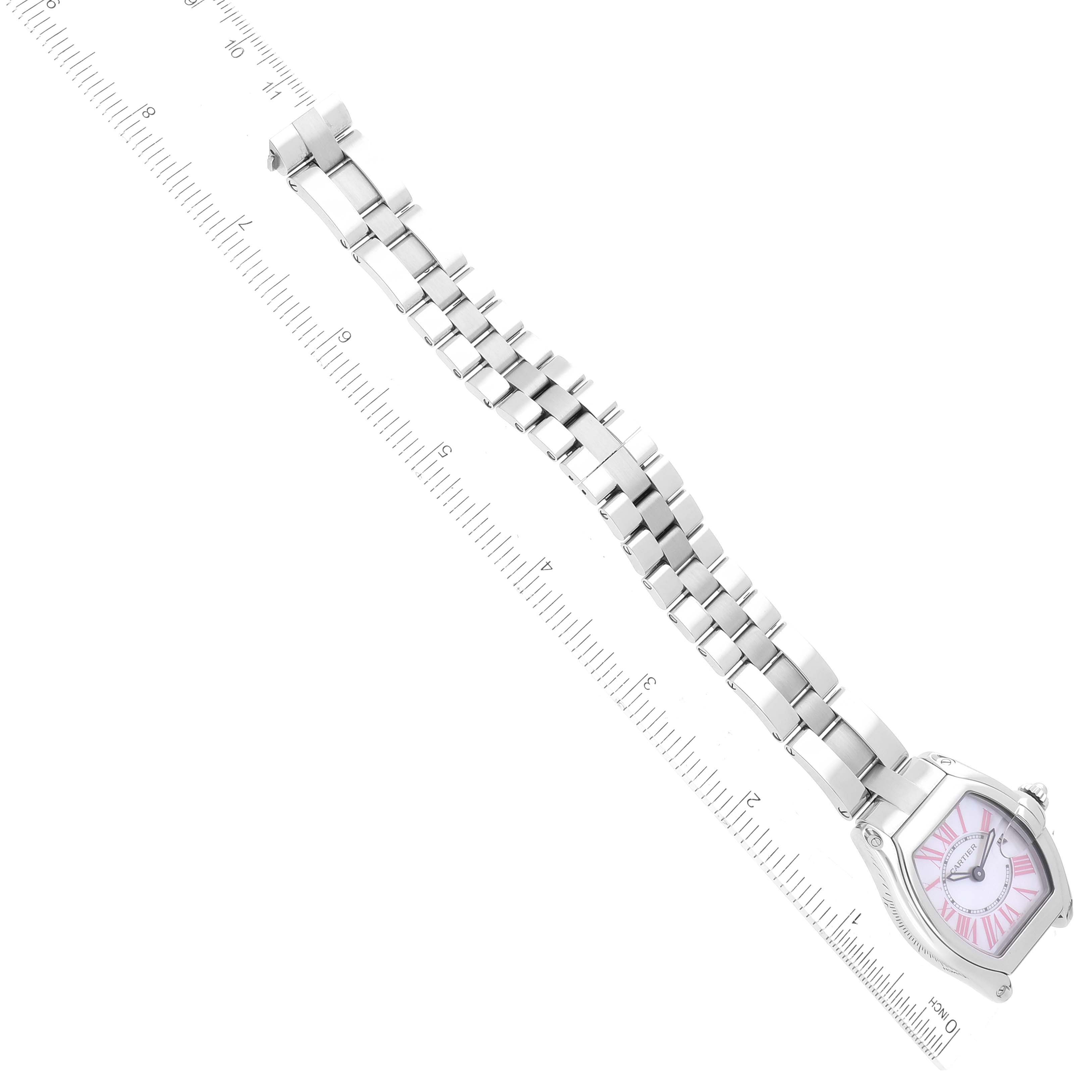 The image shows a Cartier Roadster W6206006 Women's Stainless Steel Mother of Pearl Dial W6206006 Women's Stainless Steel Mother of Pearl Dial watch laid out with its band extended alongside a ruler for measurement.