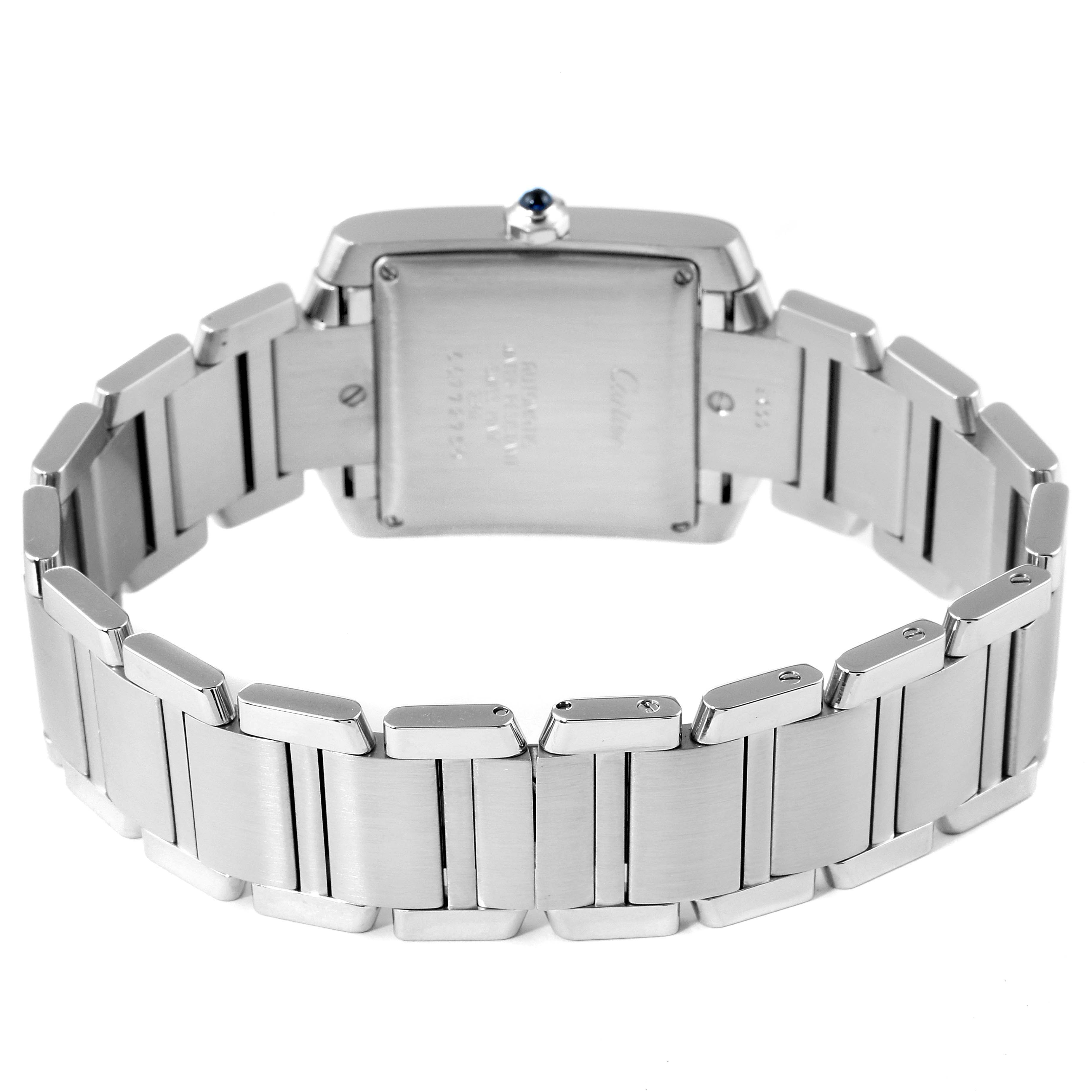 This image shows the back view of a Tank Française by Cartier, highlighting its stainless steel bracelet and case back.