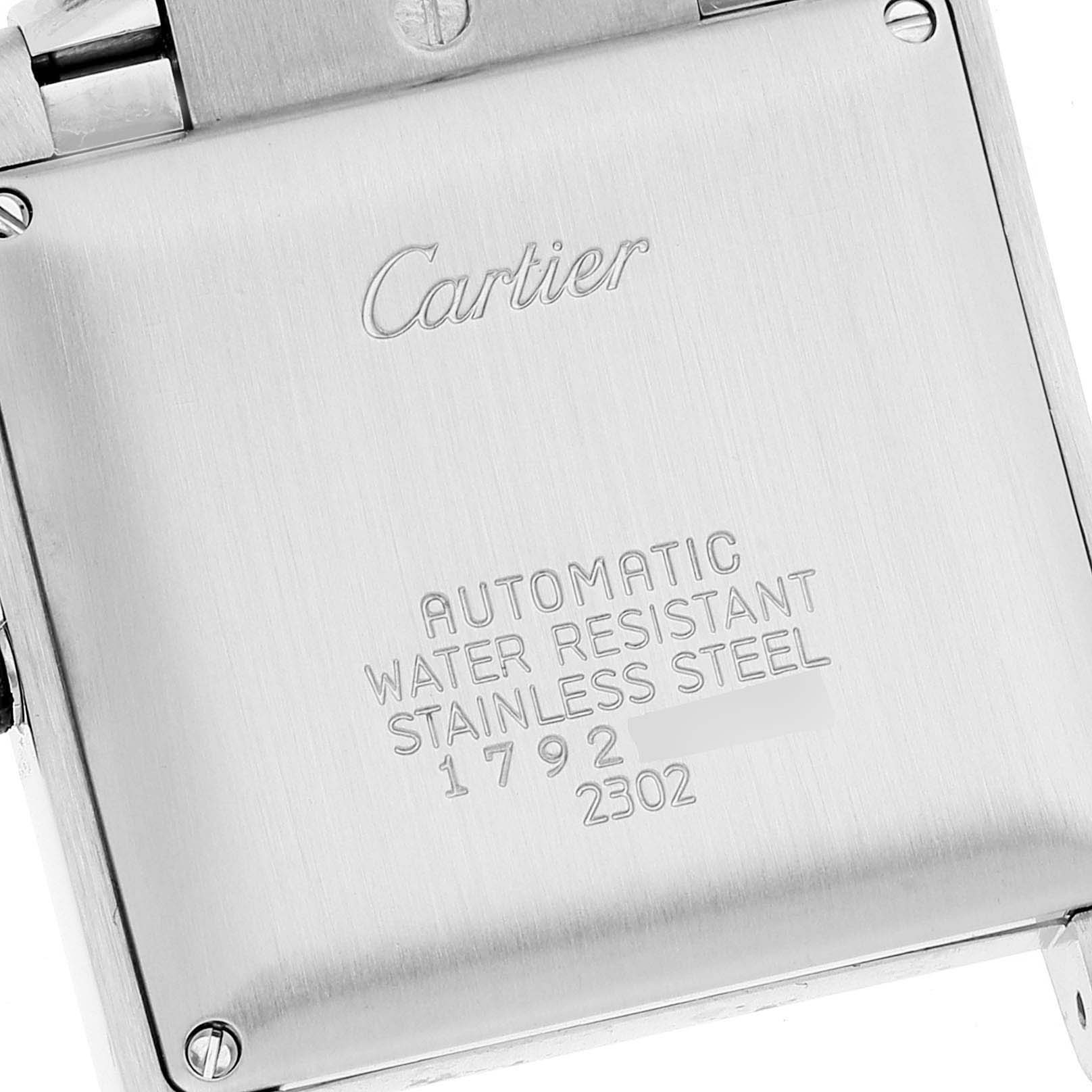This image shows a close-up of the back case of the Cartier Tank Francaise W51002Q3 Men's Stainless Steel Silver Dial W51002Q3 Men's Stainless Steel Silver Dial watch, displaying its engravings.