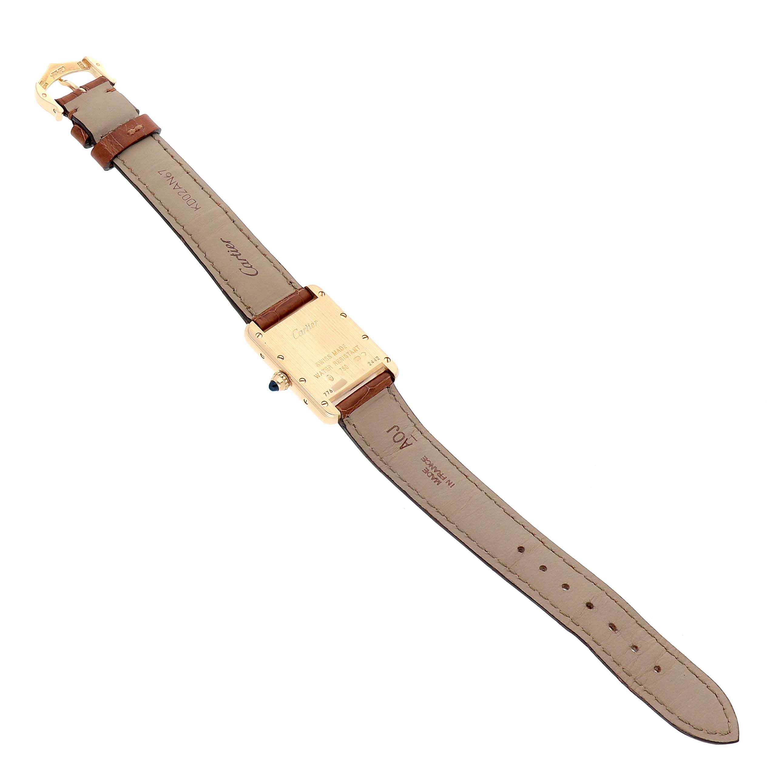 The image shows the back view of a Cartier Tank Louis W1529856 Women's Yellow Gold Silver Dial model watch, highlighting the leather strap and case back details.