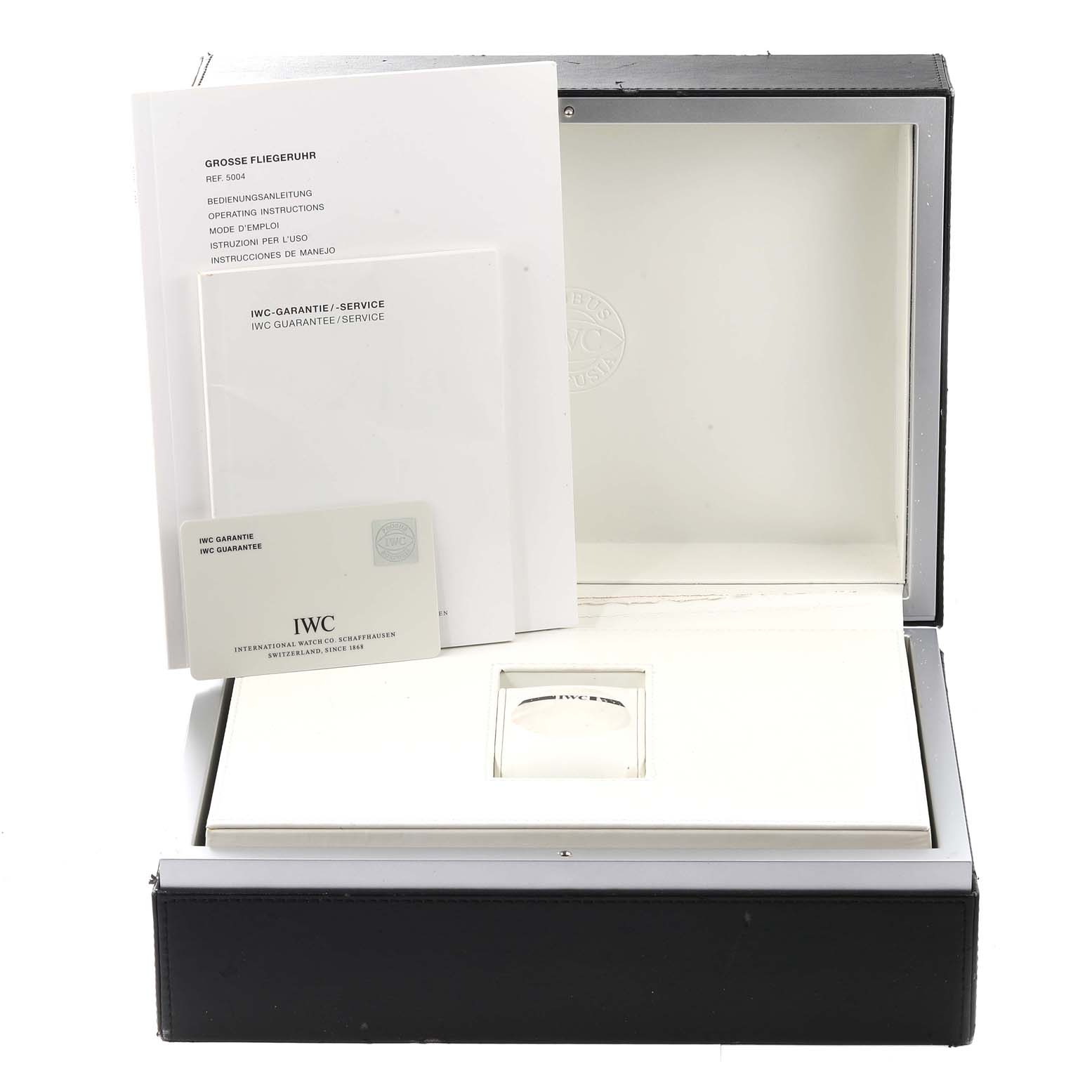 The image shows the packaging and documents for an IWC Pilot IW500401 Men's Stainless Steel Black Dial IW500401 Men's Stainless Steel Black Dial model watch, including the box, instruction manuals, and warranty card.