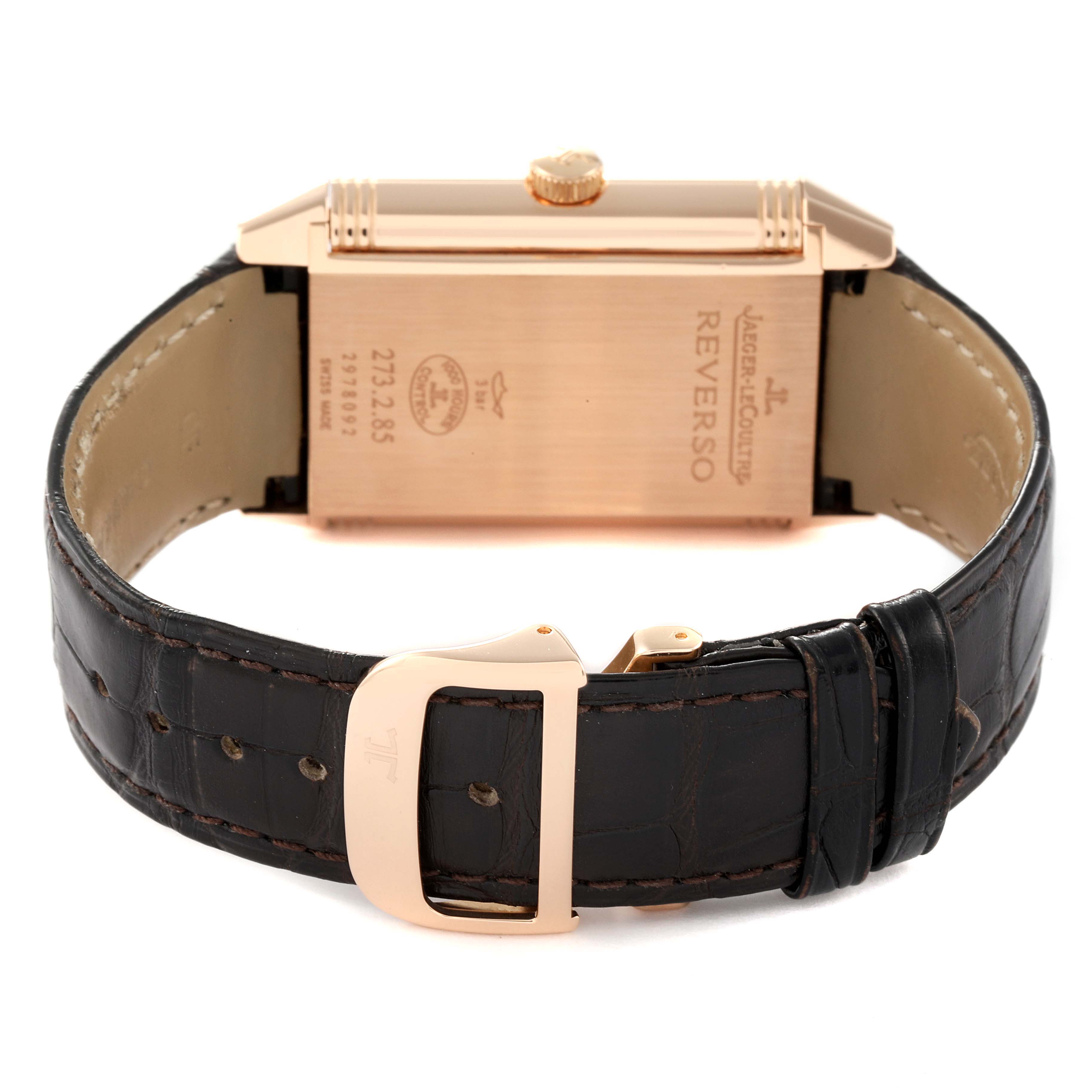 The image shows the back of a Jaeger LeCoultre Reverso Q3742521 Men
s Rose Gold Silver Dial Q3742521 Men
s Rose Gold Silver Dial watch, highlighting the leather strap and buckle.
