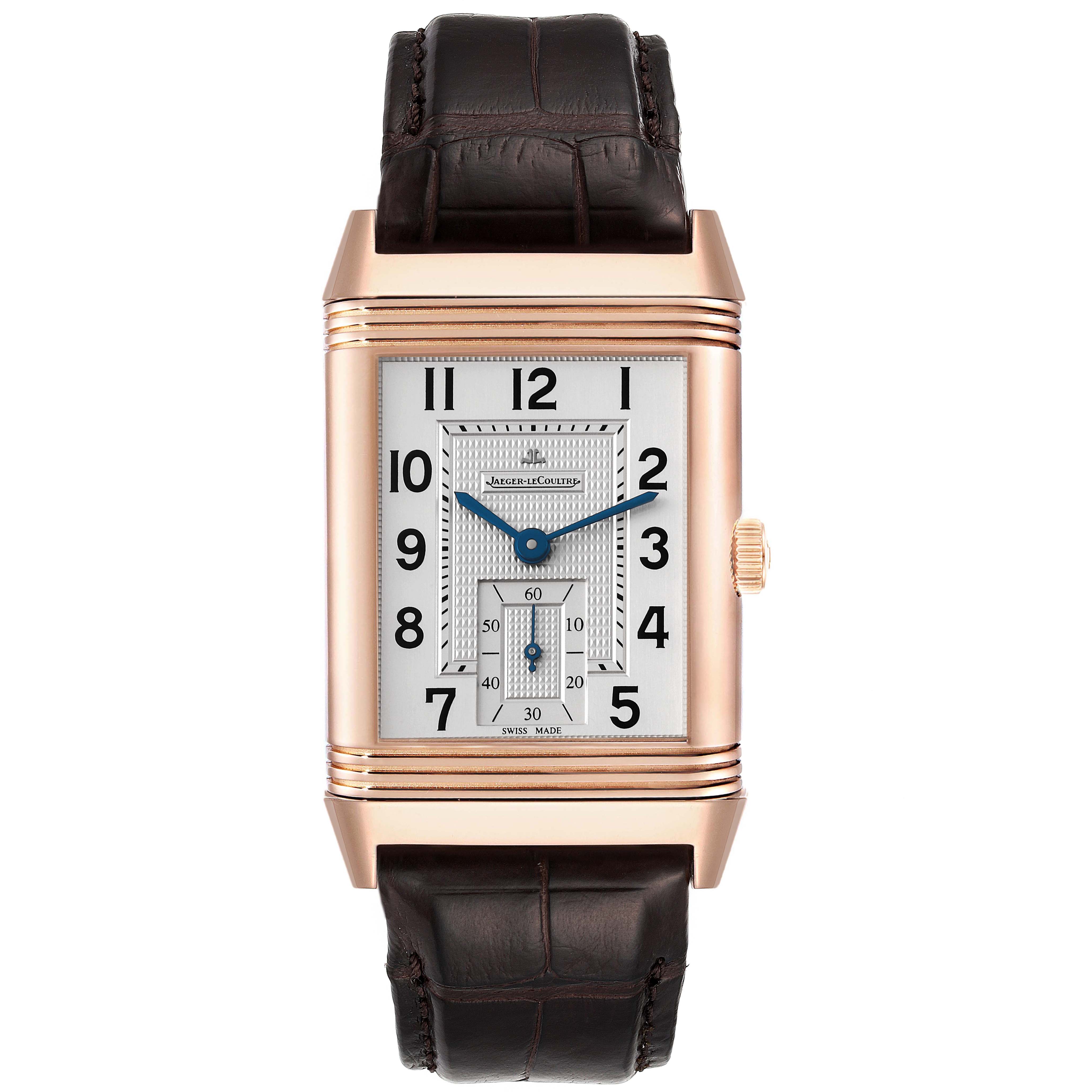 The image shows a front view of a Jaeger-LeCoultre Reverso watch, displaying its rectangular dial and black leather strap.