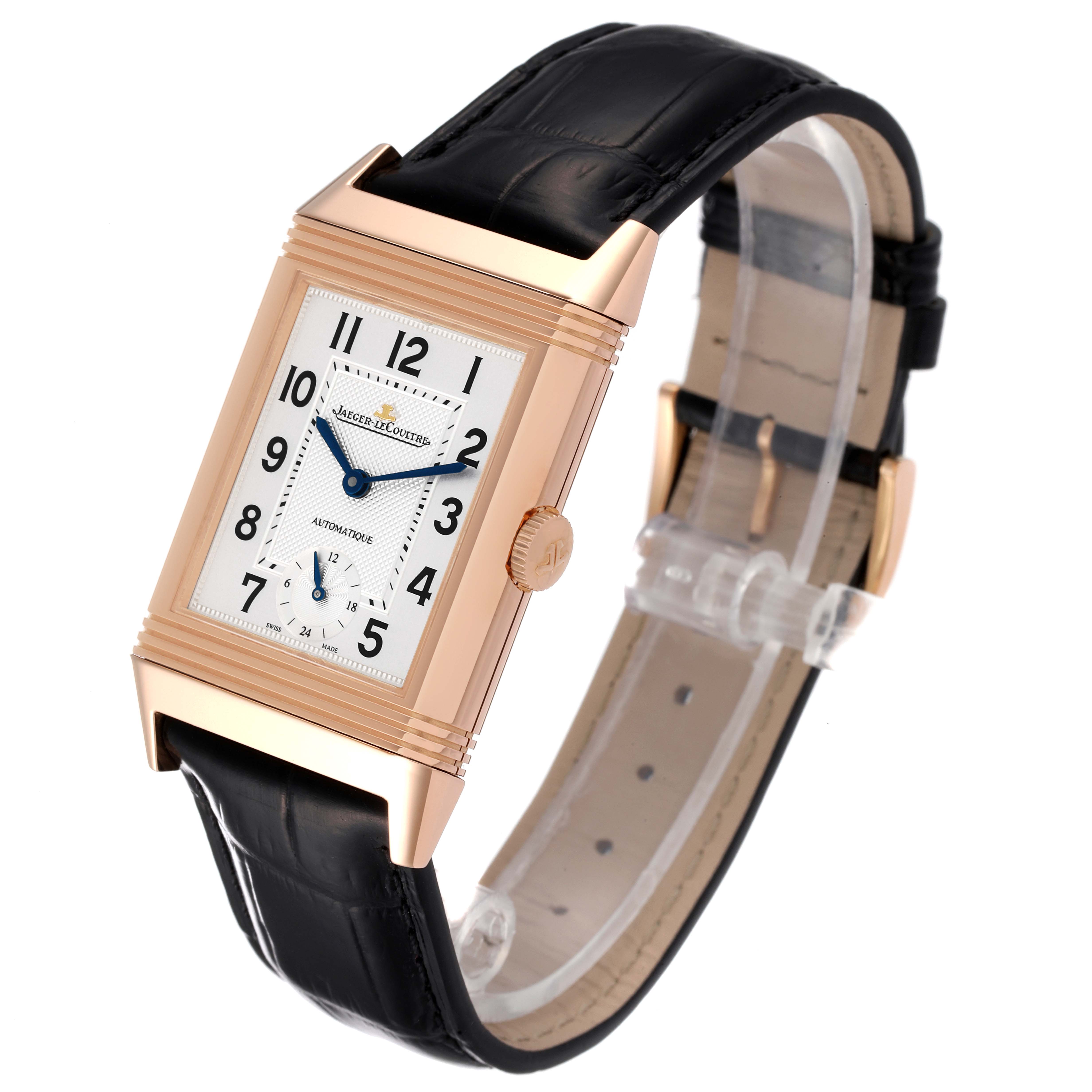 This image shows a Jaeger LeCoultre Reverso Q3802520 Men
s Rose Gold Silver Dial Q3802520 Men
s Rose Gold Silver Dial watch from an angled front view, highlighting its rectangular dial, strap, and side crown.