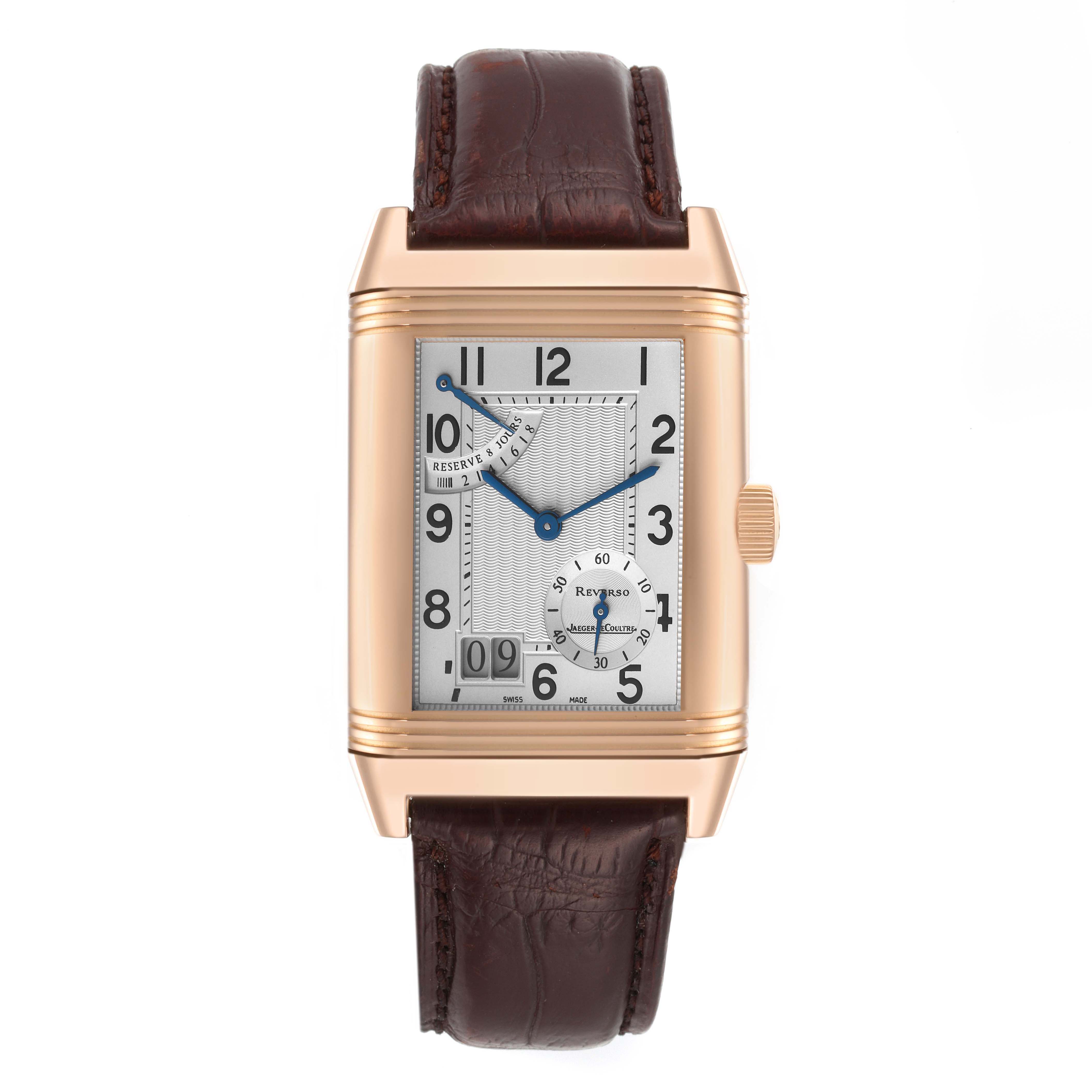 The image shows a frontal view of a Jaeger LeCoultre Reverso Q3002401 Men's Rose Gold Silver Dial Q3002401 Men's Rose Gold Silver Dial watch with a brown leather strap and gold casing.