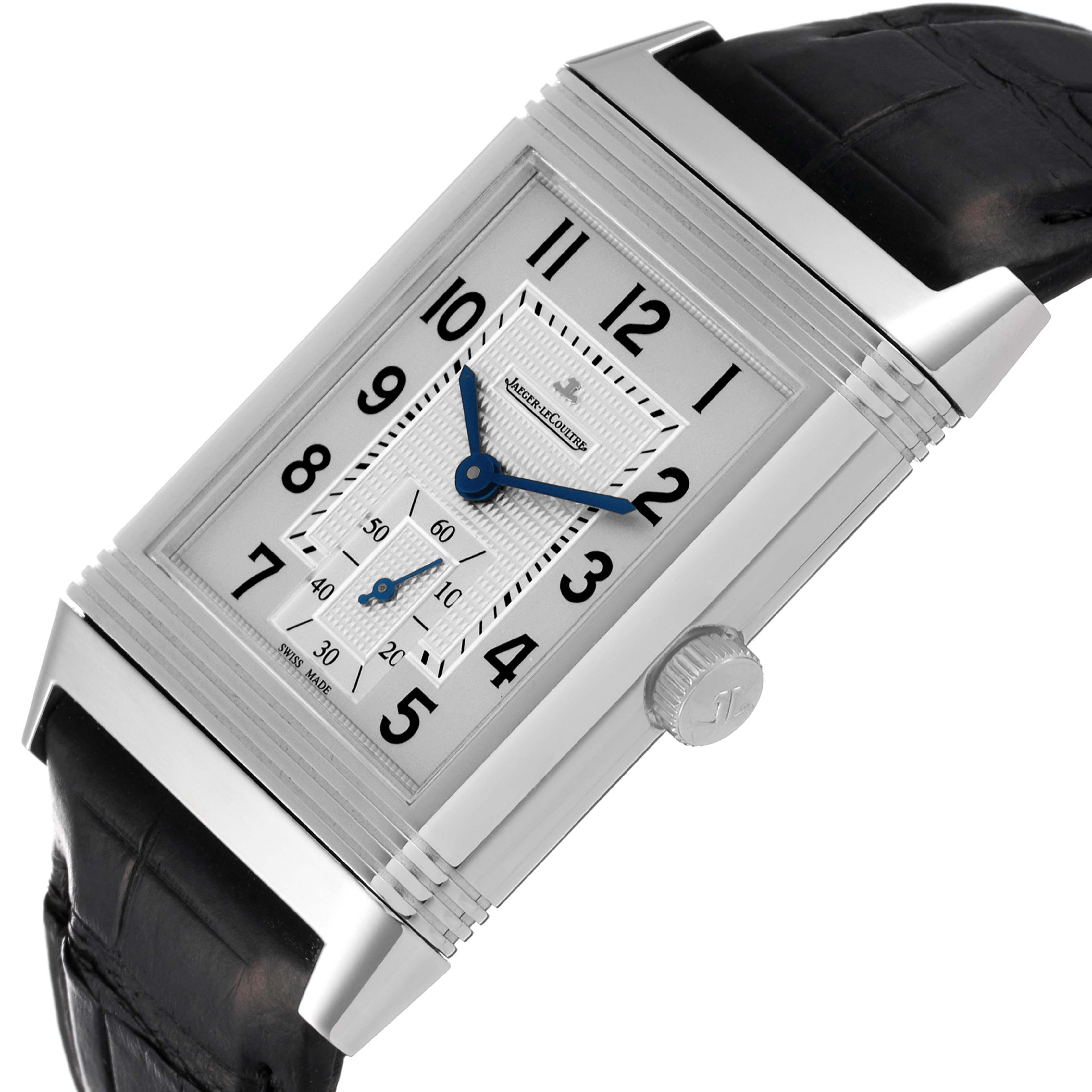 This Jaeger-LeCoultre Reverso watch is shown at an angle, highlighting its rectangular face, dial, crown, and a portion of the strap.