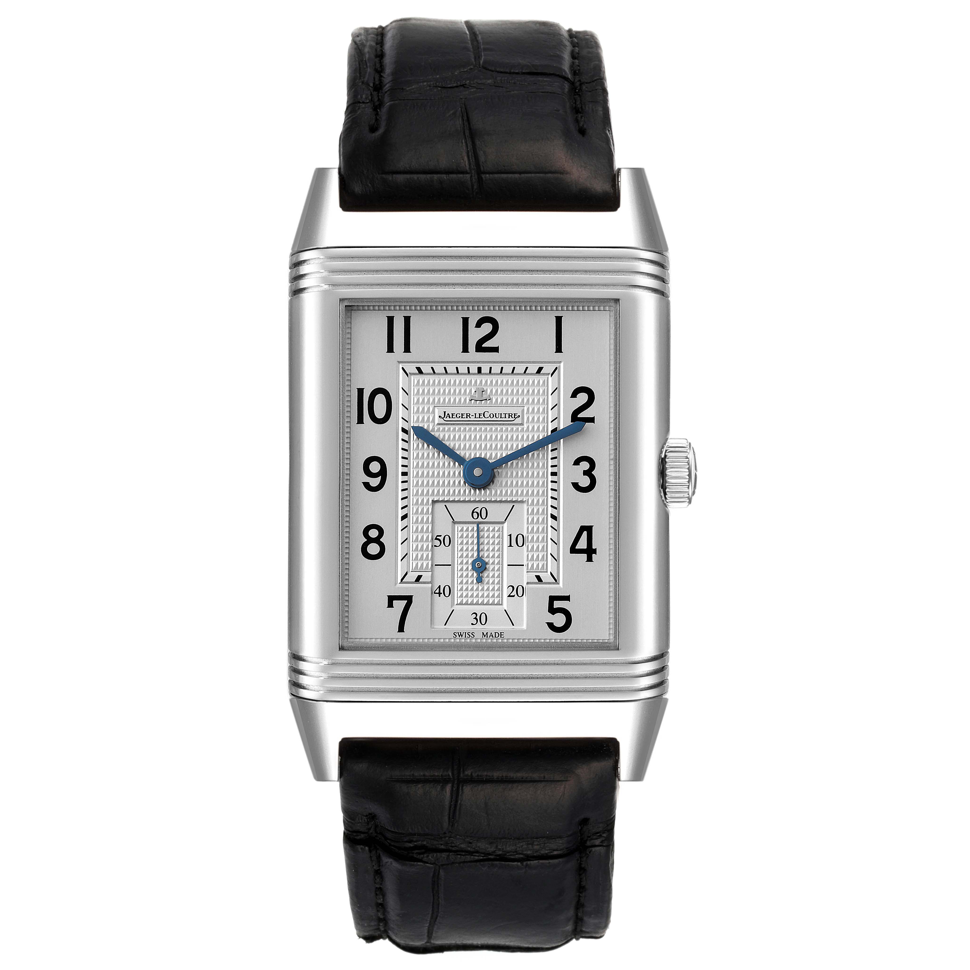 The Jaeger-LeCoultre Reverso watch is shown from a top-down angle, displaying the rectangular dial and leather strap.