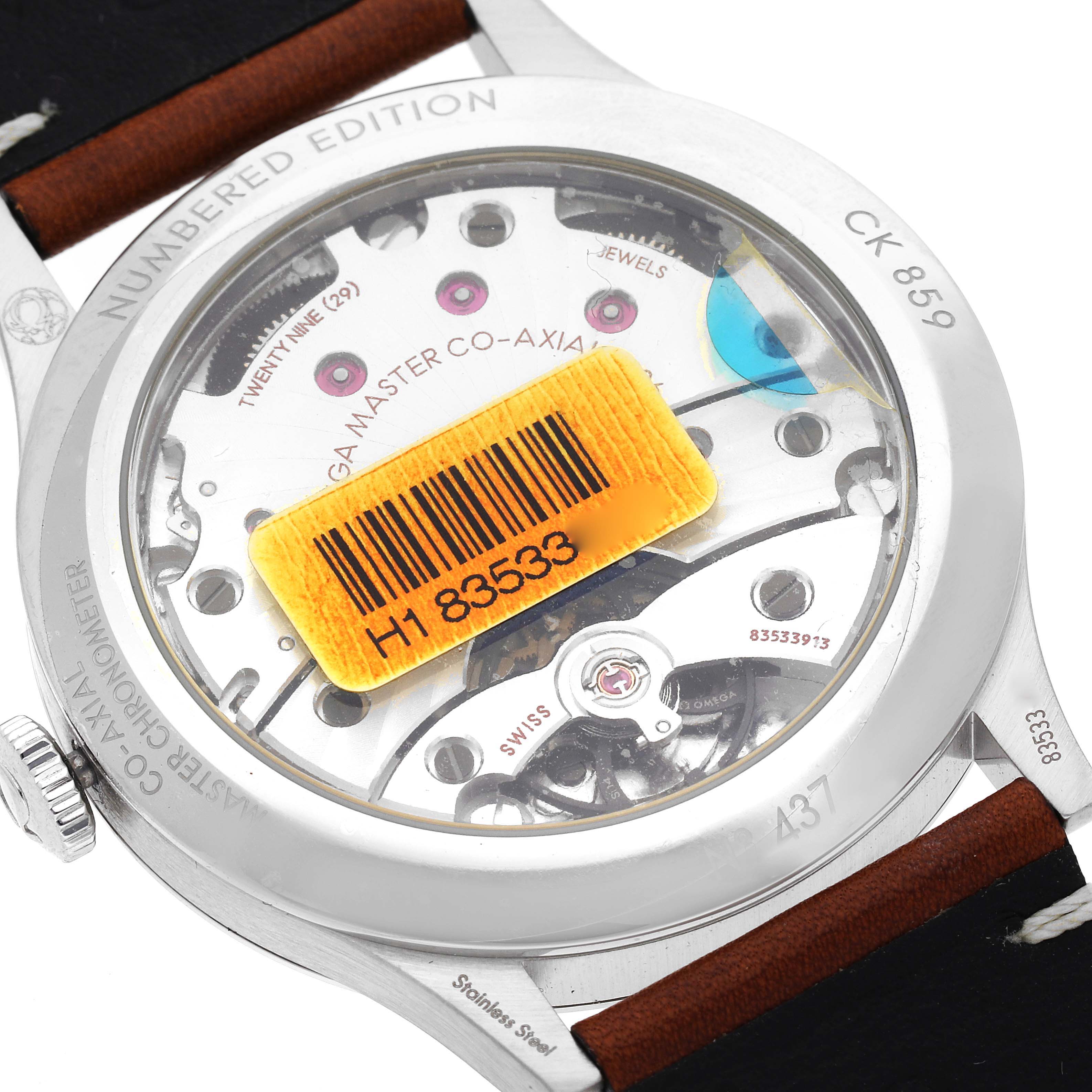 The image shows the back view of an Omega Museum 511.12.39.21.99.002 Men's Stainless Steel Grey Dial 511.12.39.21.99.002 Men's Stainless Steel Grey Dial model watch, highlighting its inner mechanism and barcode sticker.