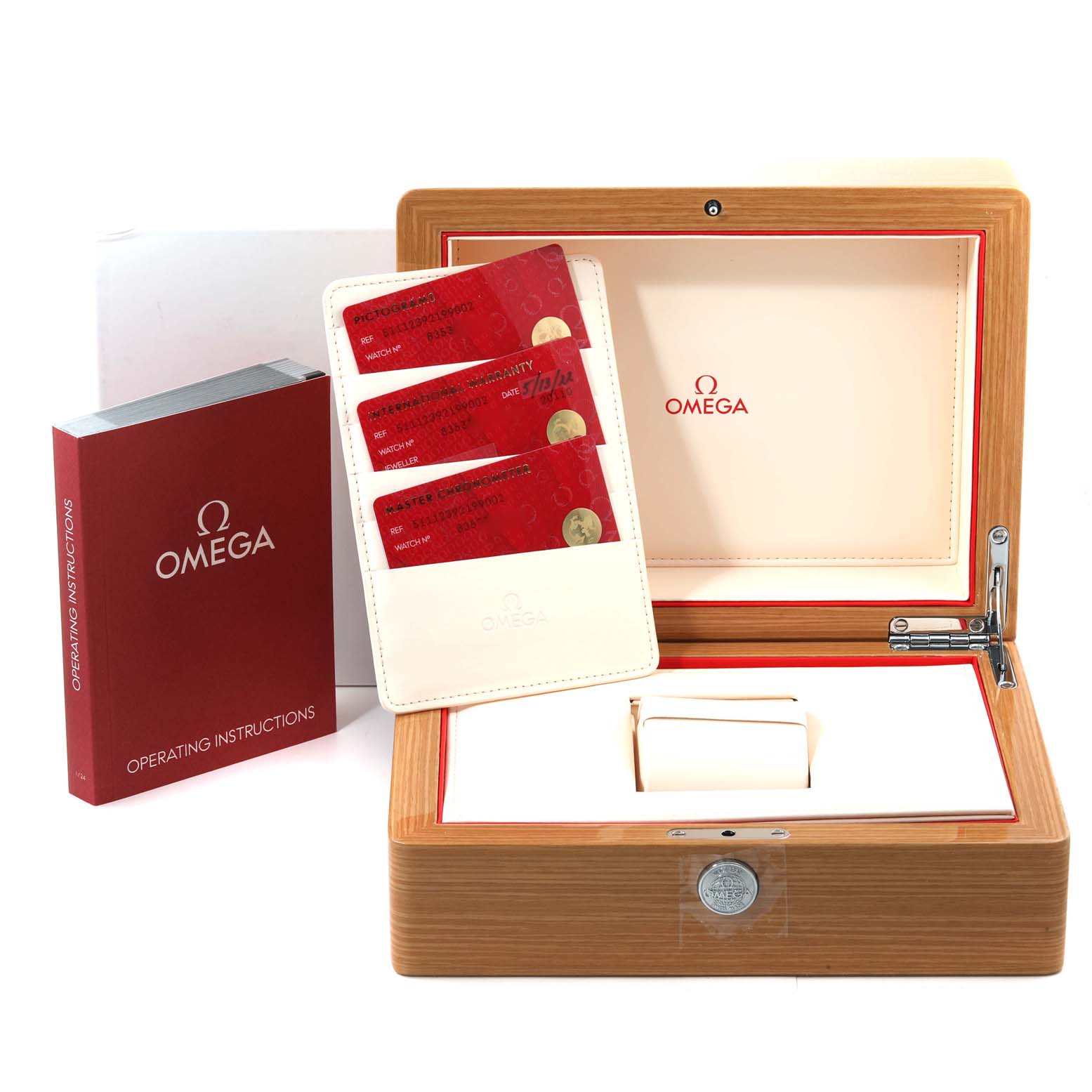 The image displays an Omega Museum 511.12.39.21.99.002 Men's Stainless Steel Grey Dial 511.12.39.21.99.002 Men's Stainless Steel Grey Dial model watch box, warranty cards, and operating instructions, all photographed from the front.