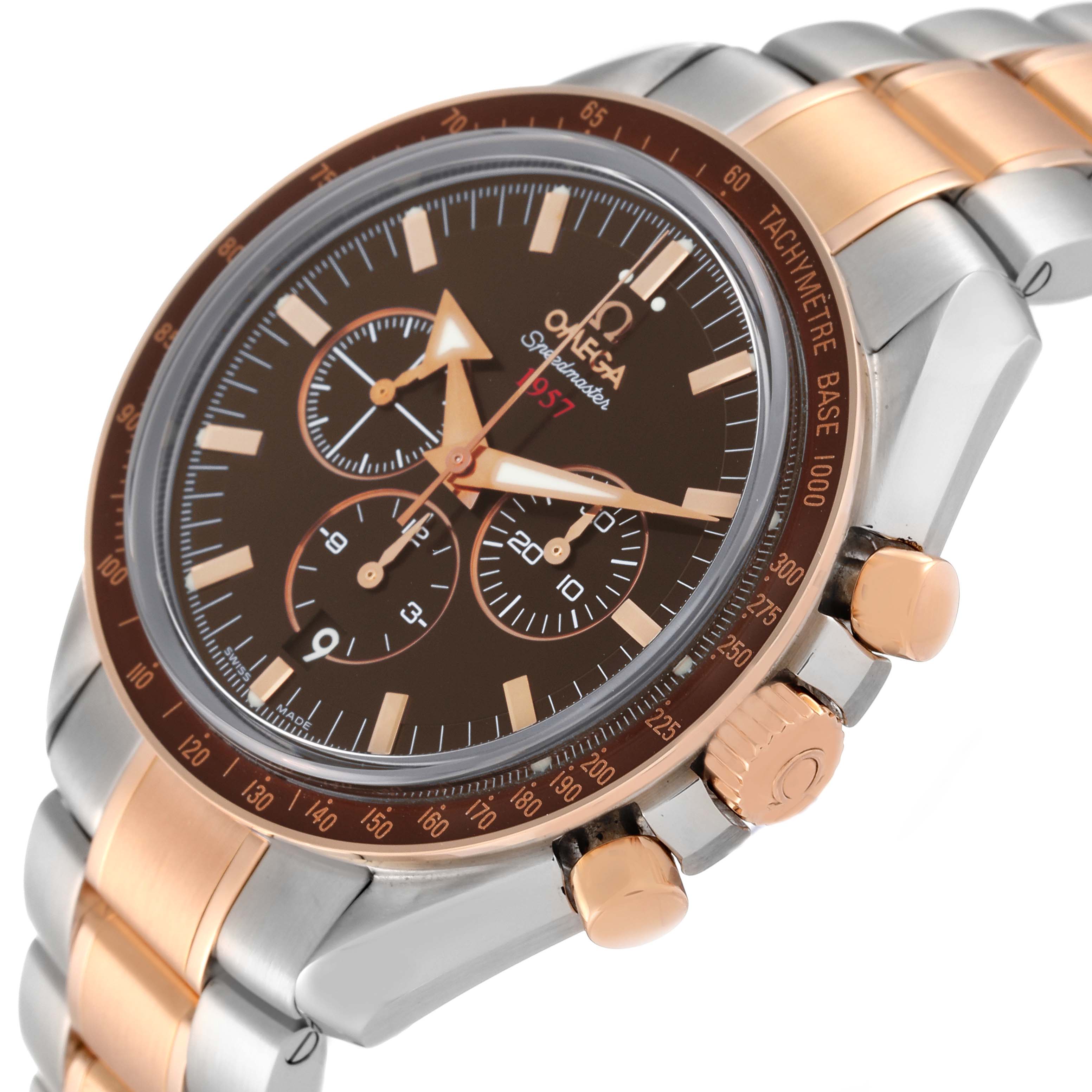 The image shows a side angle of the Omega Speedmaster 321.90.42.50.13.001 Men's Steel and Gold (two tone) Brown Dial 321.90.42.50.13.001 Men's Steel and Gold (two tone) Brown Dial watch, highlighting its dial, tachymetre, pushers, and part of the bracelet.