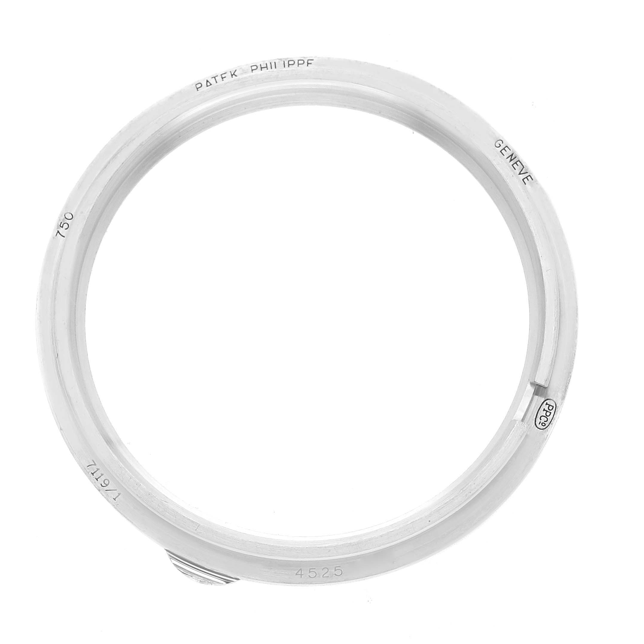 The image shows the bezel of a Patek Philippe Calatrava 7119 Women's White Gold White Dial watch from a top-down angle.