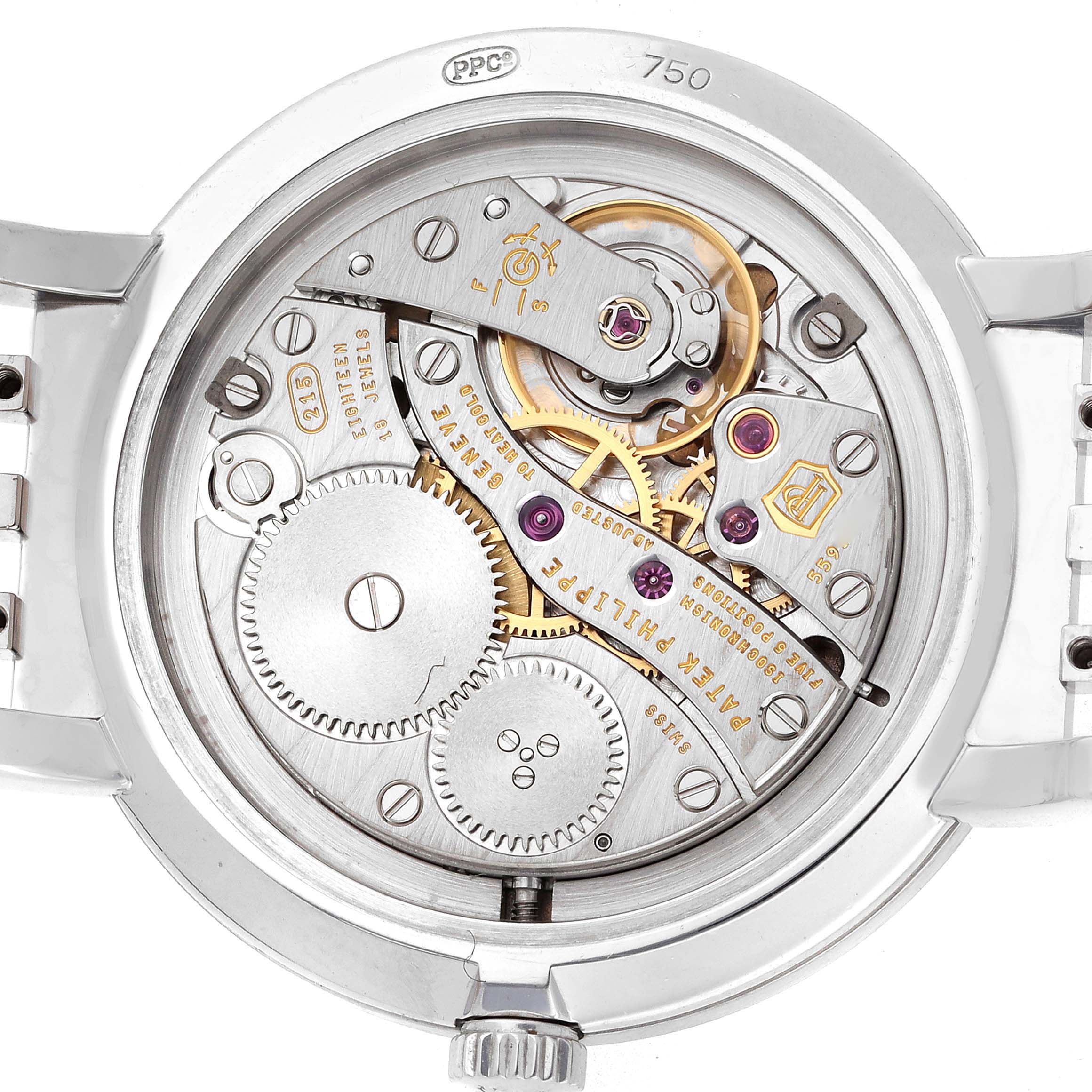 This image shows the back view of a Patek Philippe Calatrava 7119 Women's White Gold White Dial watch, highlighting its intricate mechanical movement and components.