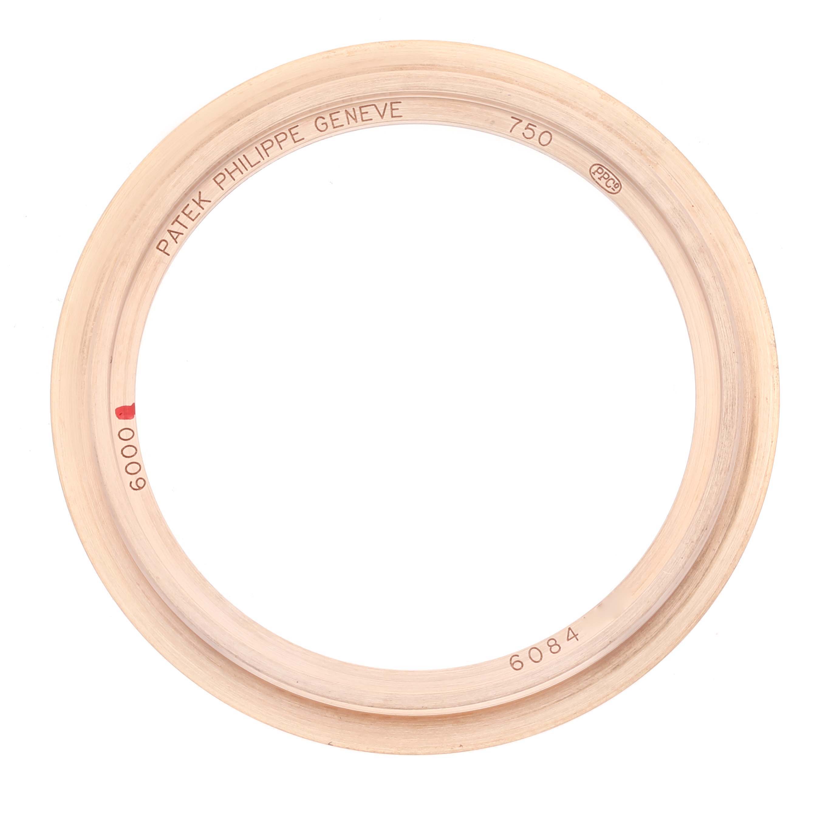 This image shows a Patek Philippe Calatrava 6000R-001 Men's Rose Gold Brown Dial 6000R-001 Men's Rose Gold Brown Dial watch bezel photographed from a top-down angle.