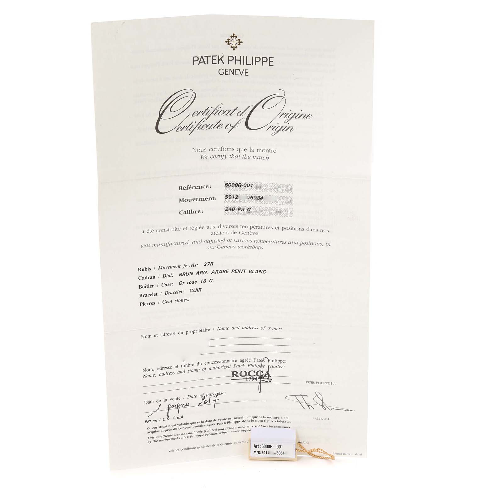 The image shows the Certificate of Origin for the Patek Philippe Calatrava 6000R-001 Men's Rose Gold Brown Dial 6000R-001 Men's Rose Gold Brown Dial model, detailing specifications and authenticity.