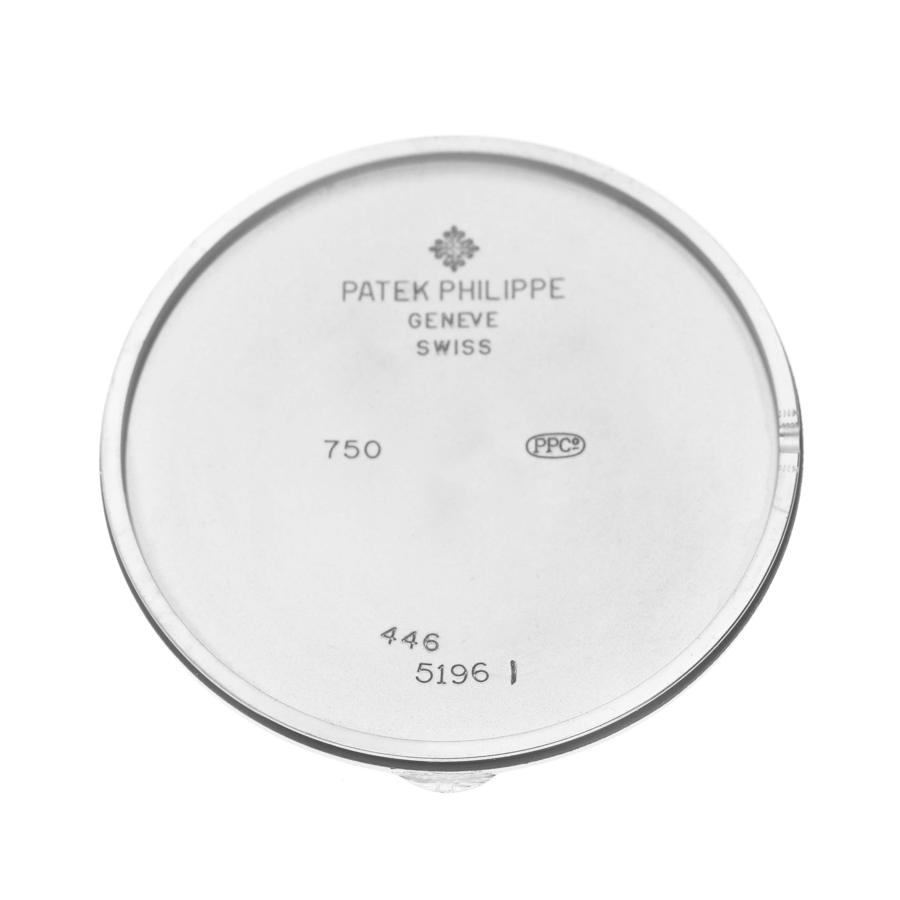 The image shows the inside of the case back of a Patek Philippe Calatrava 5196 Men
s White Gold Silver Dial watch, displaying engravings and branding.