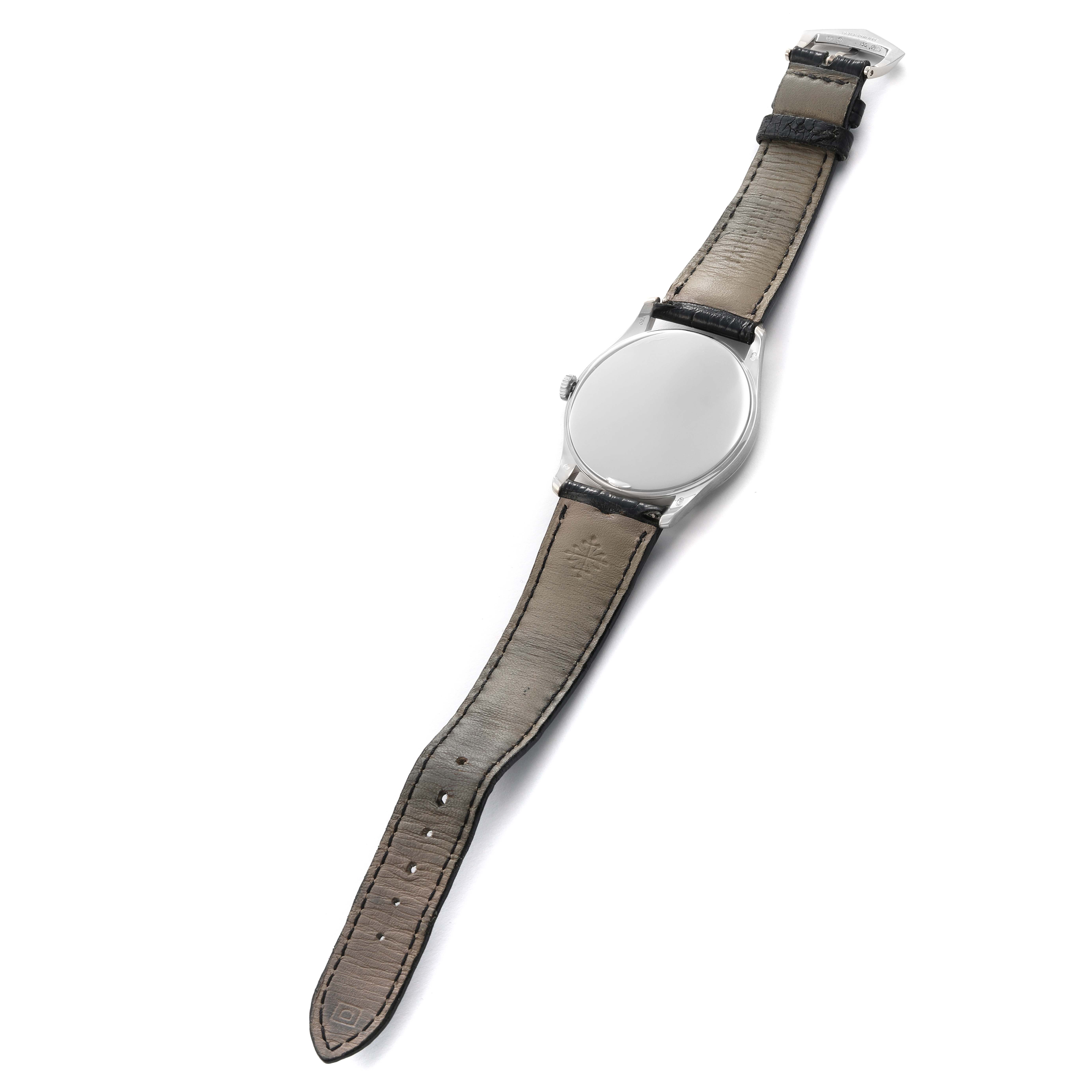 The Patek Philippe Calatrava 5196 Men
s White Gold Silver Dial watch is shown from a top-down angle, displaying the full strap and case back.