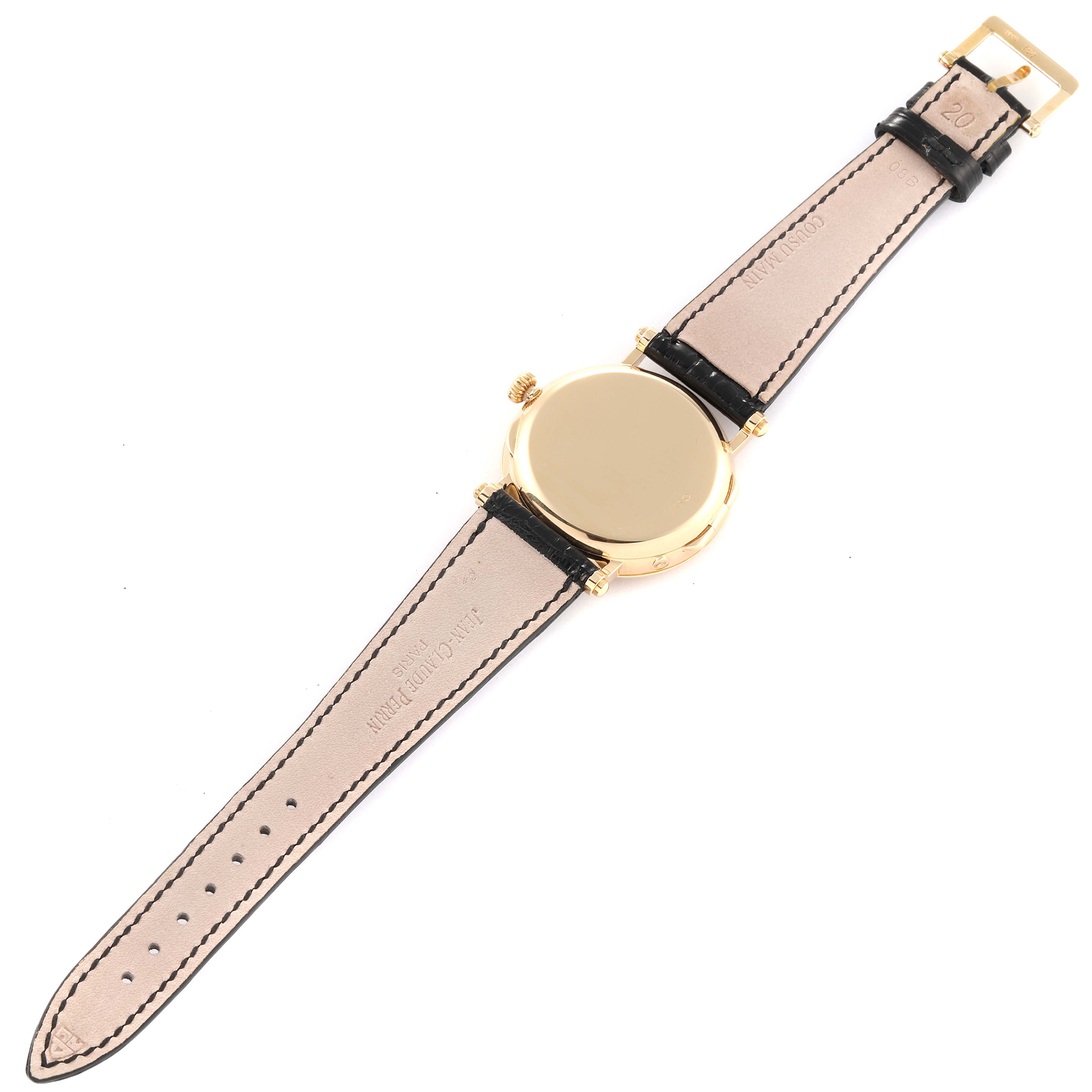 This image shows the back case and straps of a Patek Philippe Calatrava 5015J-001 Men
s Yellow Gold White Dial 5015J-001 Men
s Yellow Gold White Dial watch from a top-down angle.