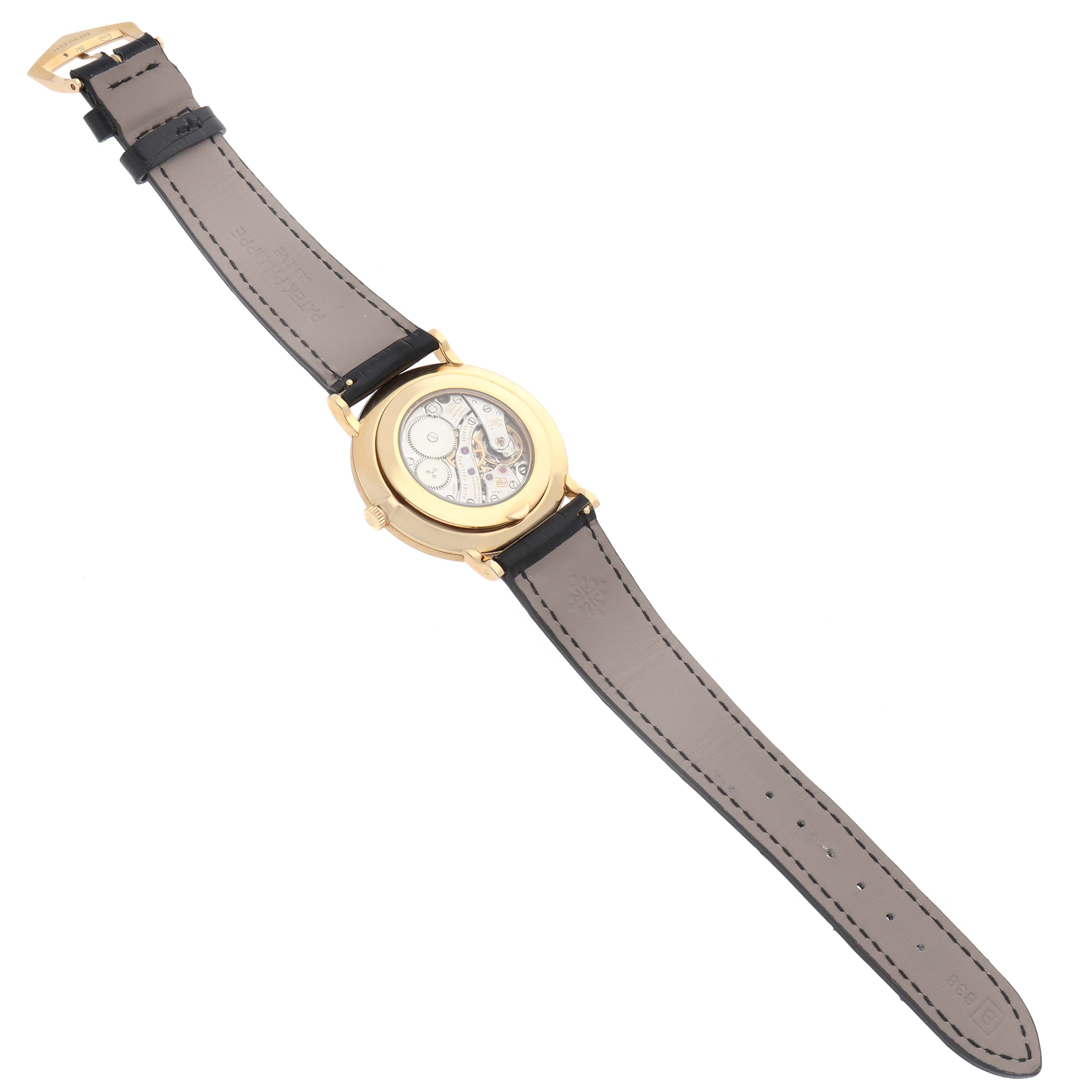 The Patek Philippe Calatrava 5119 Men
s Yellow Gold White Dial watch is shown in a top view, displaying its back case and the inner mechanics.