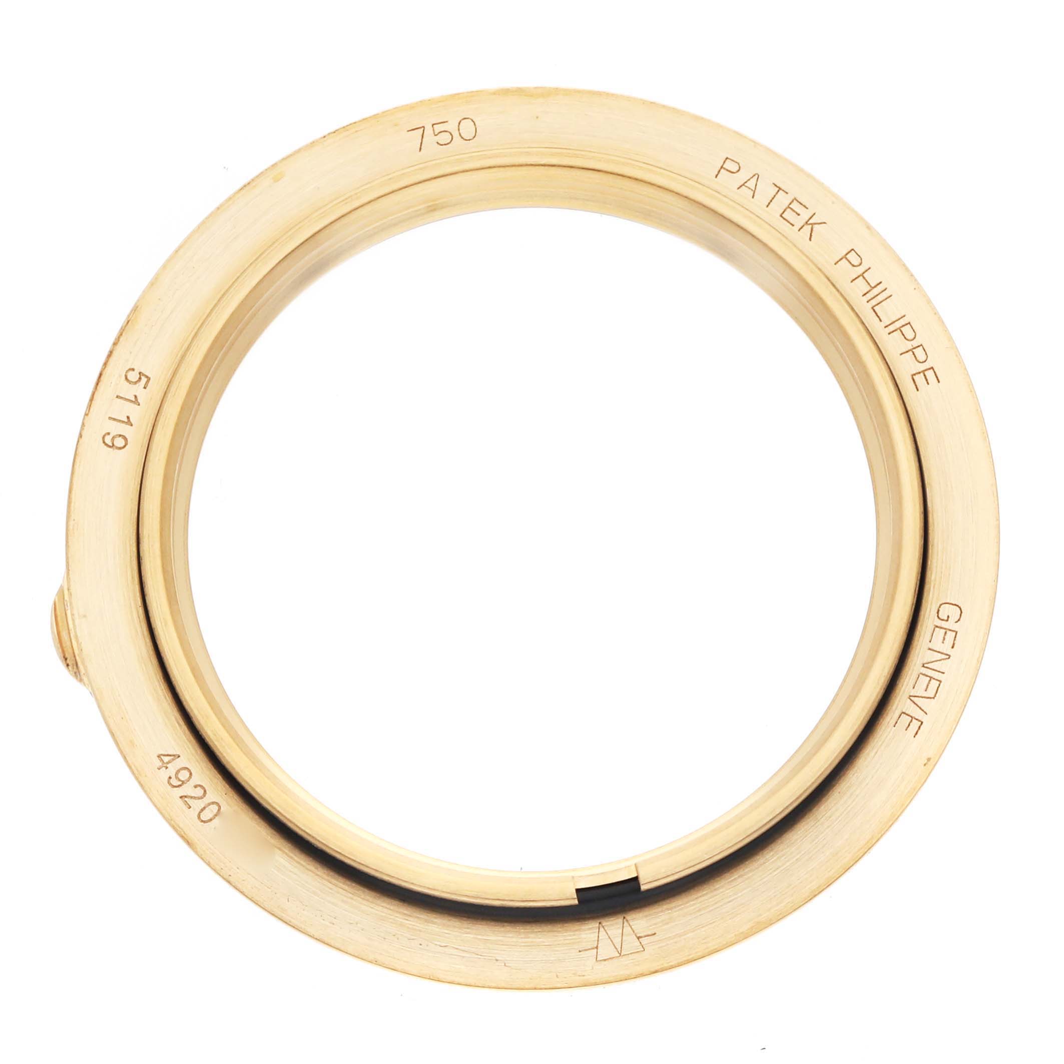 The image shows the bezel of a Patek Philippe Calatrava 5119 Men
s Yellow Gold White Dial watch, viewed from above, displaying the brand name and model numbers.