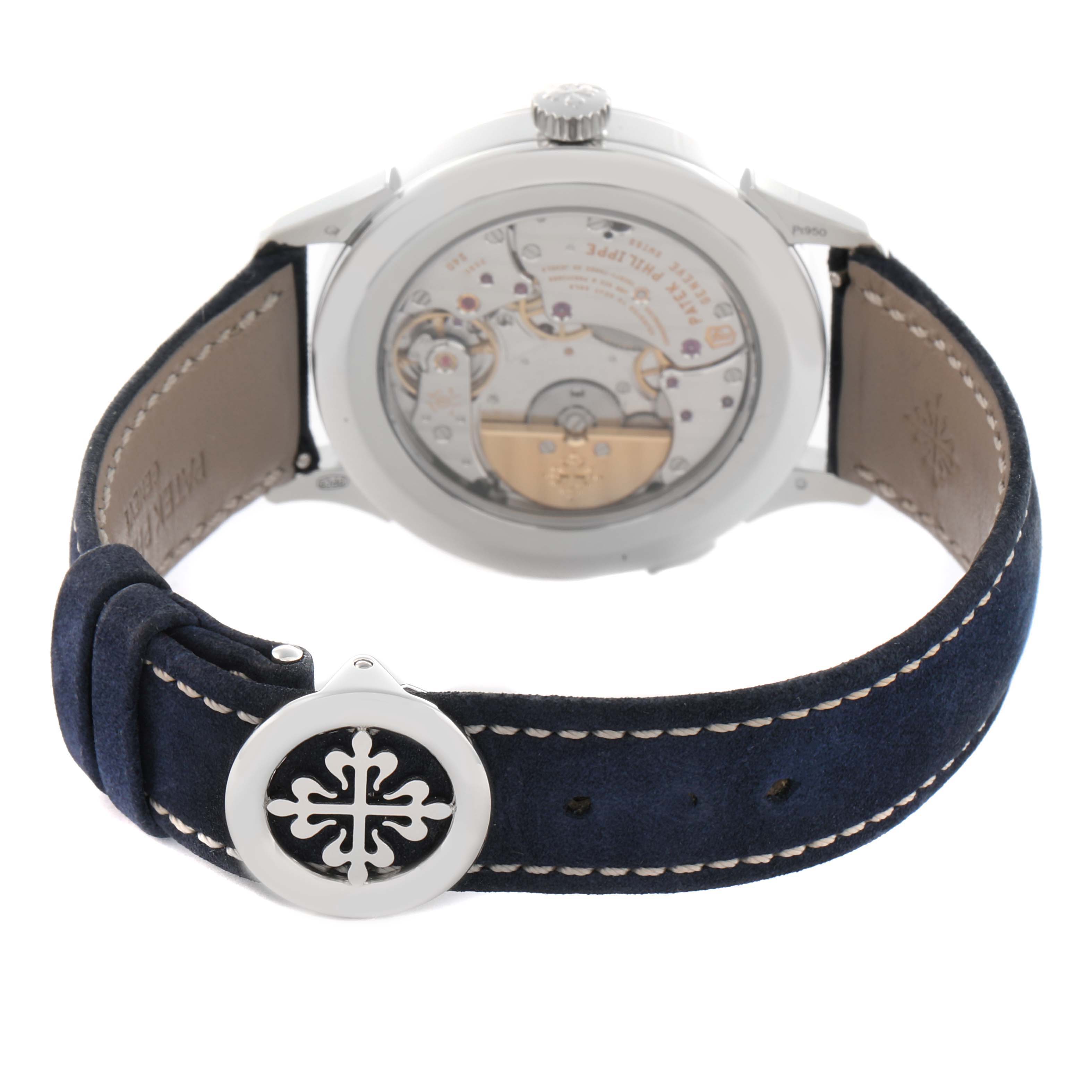 The Patek Philippe Complications 5230P-001 Men's Platinum Blue Dial watch is shown from the back, highlighting the movement and a blue strap with a logo.