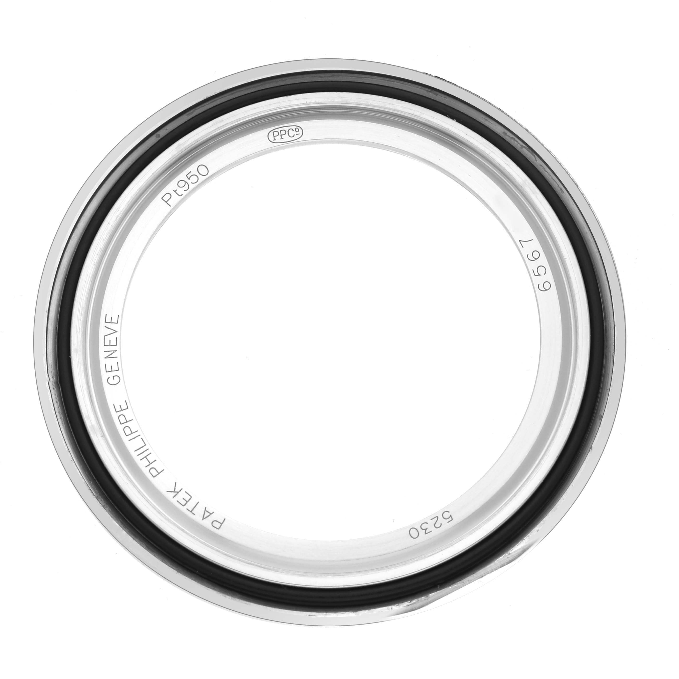 The image shows a top-down view of the bezel for a Patek Philippe Complications 5230P-001 Men's Platinum Blue Dial watch with markings and inner seals visible.