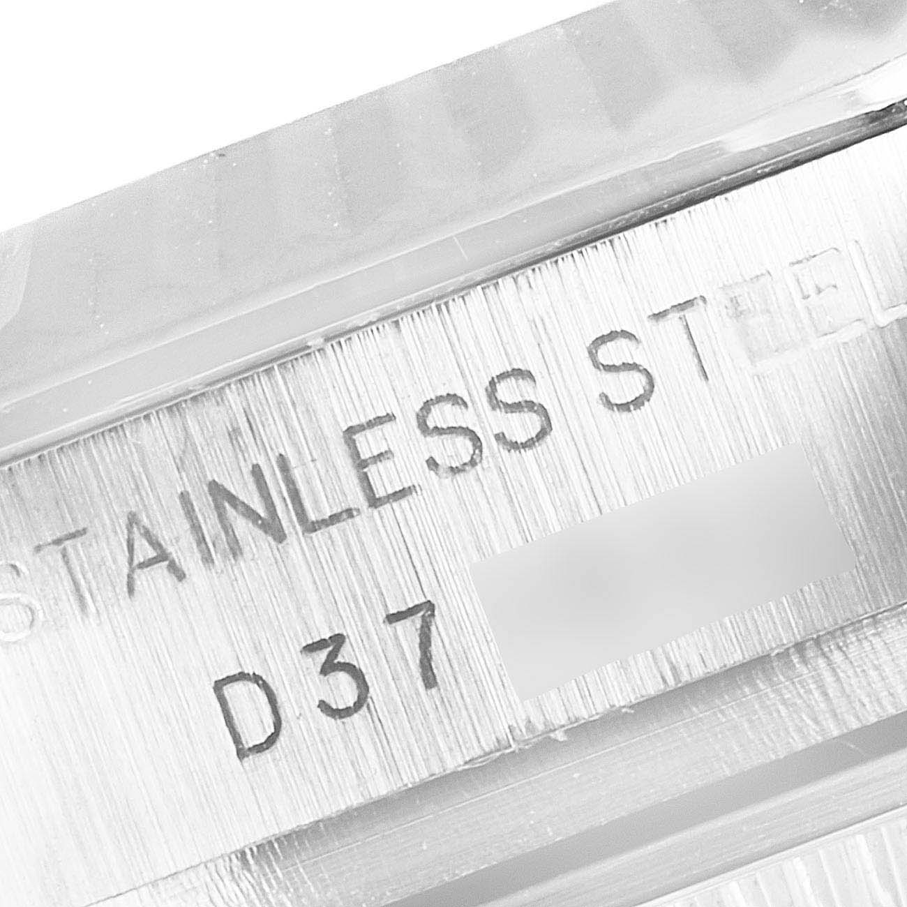 The image shows a close-up of the serial number engraving on the stainless steel band of a Rolex Datejust 179174 Women's Steel and Gold (two tone) Silver Dial 179174 Women's Steel and Gold (two tone) Silver Dial watch.