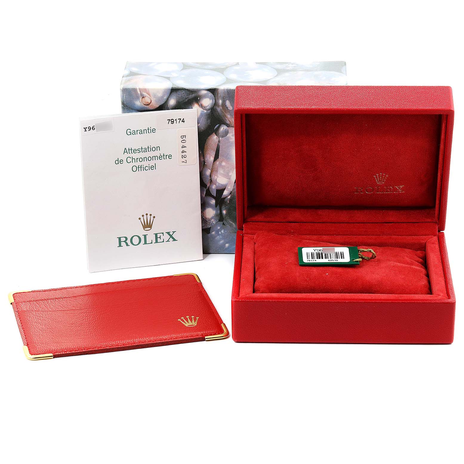 This image shows a Rolex Datejust 79174 Women's Stainless Steel Pink Dial 79174 Women's Stainless Steel Pink Dial watch box, warranty document, and red leather holder from a front angle.
