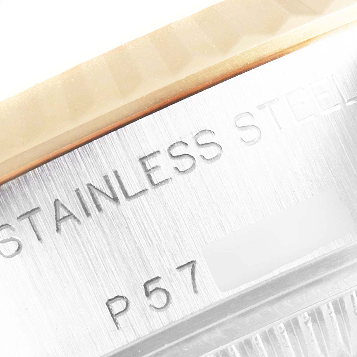 The image shows a close-up of the stainless steel case and part of the bezel of a Rolex Datejust 79173 Women's Steel and Gold (two tone) White Dial 79173 Women's Steel and Gold (two tone) White Dial watch.