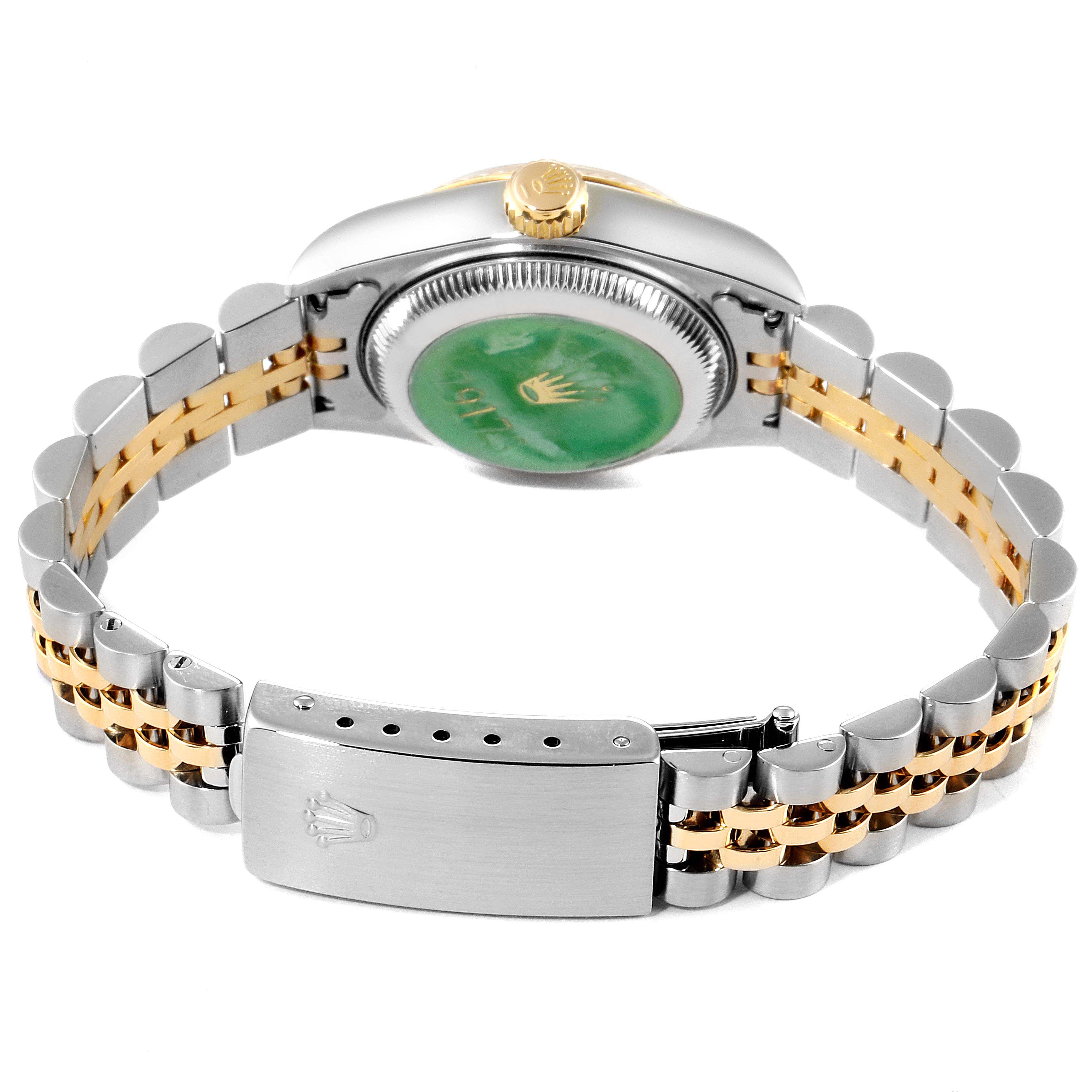The image shows the back and side view of a Rolex Datejust 79173 Women's Steel and Gold (two tone) White Dial 79173 Women's Steel and Gold (two tone) White Dial watch, highlighting its clasp, bracelet, and case back.