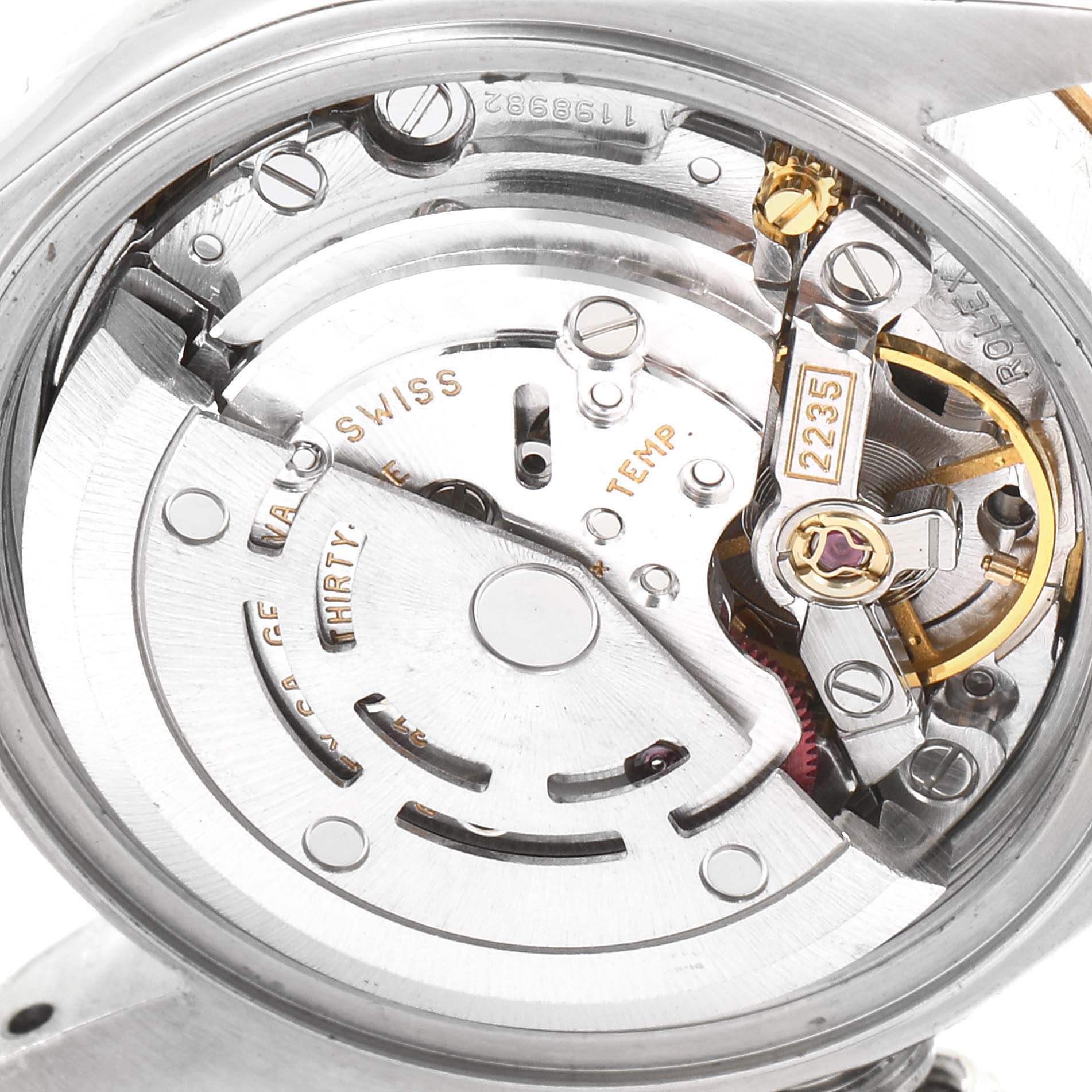 The image shows the intricate internal mechanism of a Rolex Datejust 79173 Women's Steel and Gold (two tone) White Dial 79173 Women's Steel and Gold (two tone) White Dial watch from a close-up, top-down angle.