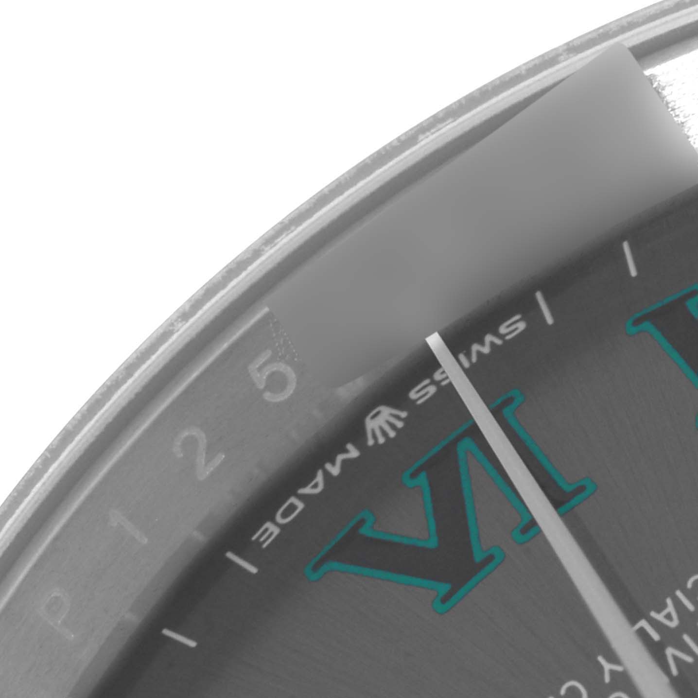 The image shows a close-up of the dial, minute markers, and part of the Roman numeral VI of a Rolex Datejust 126200 Men's Stainless Steel Grey Dial 126200 Men's Stainless Steel Grey Dial watch.