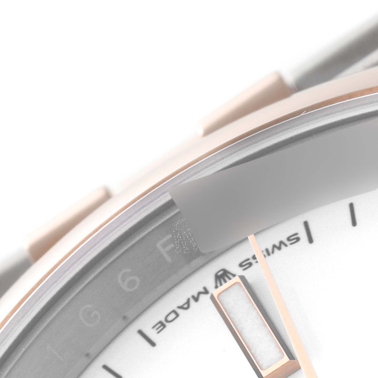 The image shows a close-up of the Rolex Datejust 126201 Men's Steel and Gold (two tone) White Dial 126201 Men's Steel and Gold (two tone) White Dial watch, focusing on the dial and edge of the bezel.