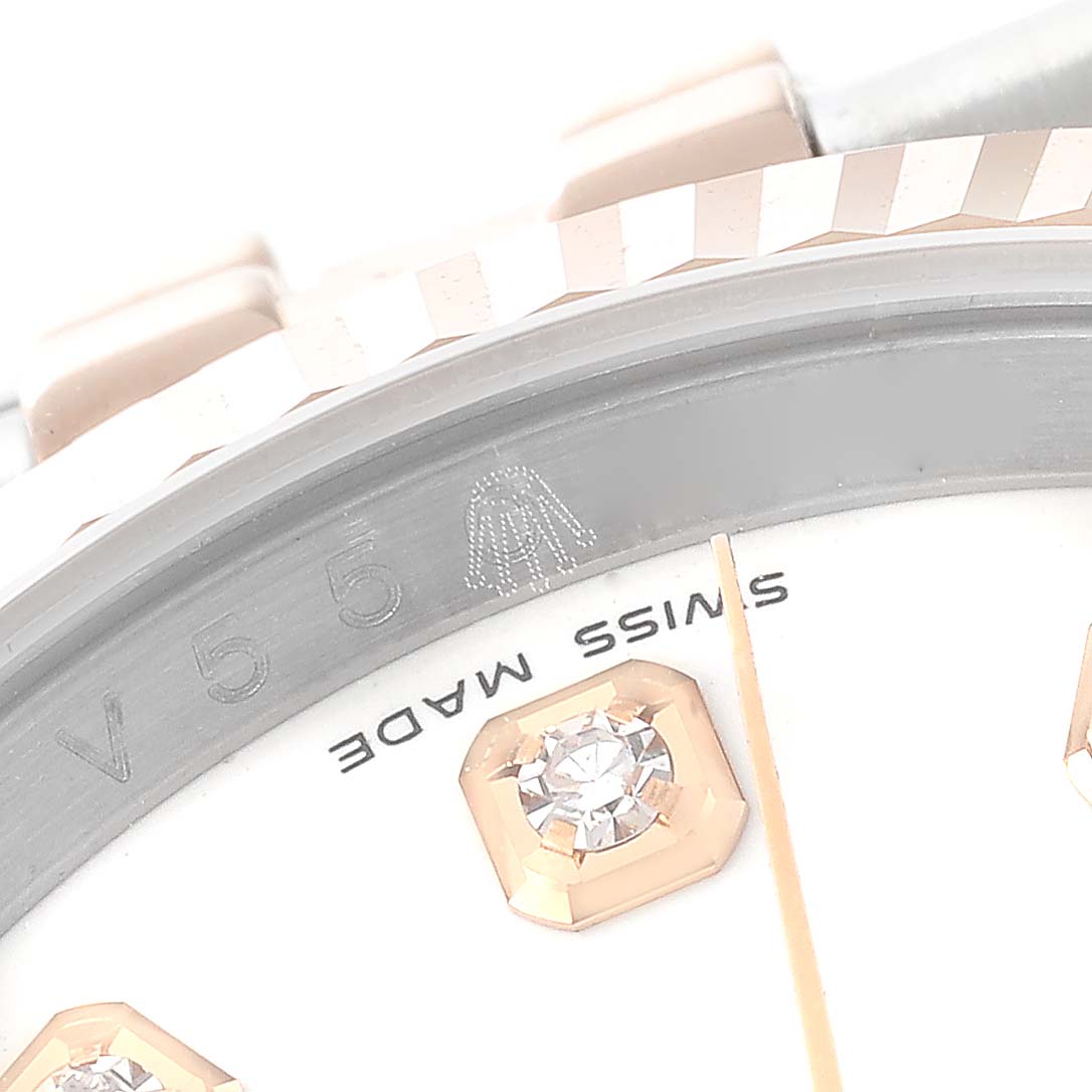 This is a close-up of the dial and bezel of a Rolex Datejust 116231 Men's Steel and Gold (two tone) White Dial 116231 Men's Steel and Gold (two tone) White Dial watch, showing a diamond marker and "Swiss Made" text.