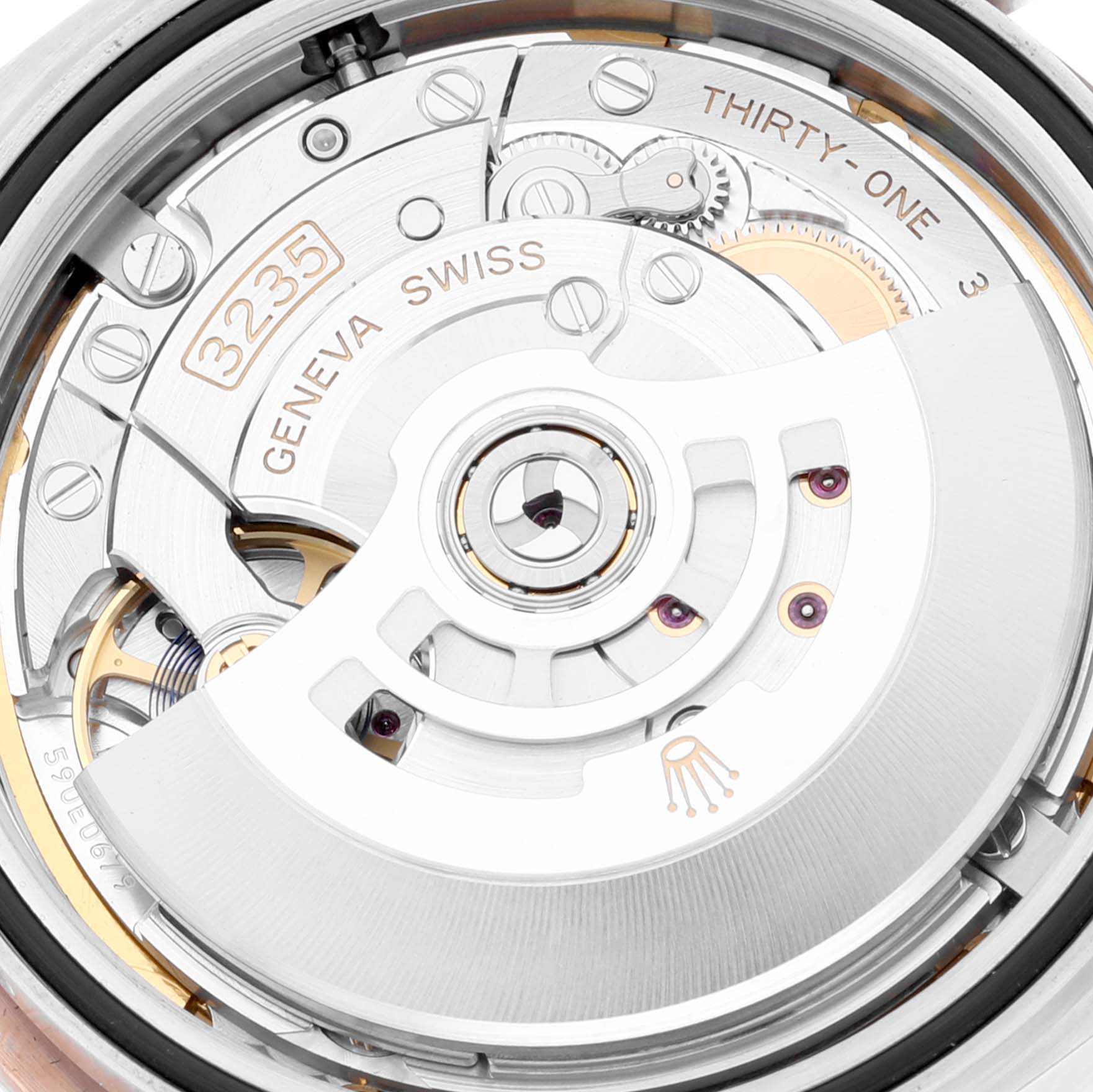 This close-up image showcases the intricate movement and inner mechanics of the Rolex Datejust 41 126331 Men's Steel and Gold (two tone) Brown Dial 126331 Men's Steel and Gold (two tone) Brown Dial model.