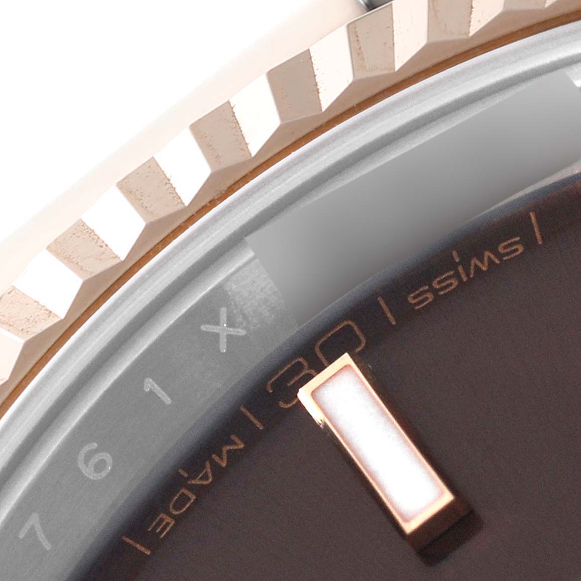 The image shows a close-up of the bezel, part of the dial, and markers of the Rolex Datejust 41 126331 Men's Steel and Gold (two tone) Brown Dial 126331 Men's Steel and Gold (two tone) Brown Dial watch.