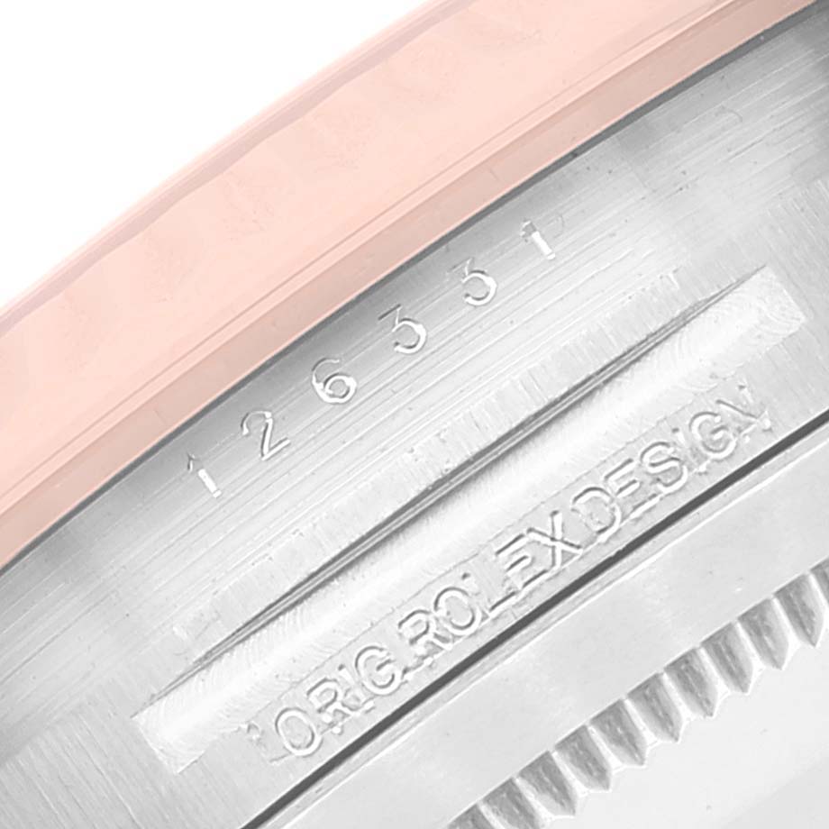 This image shows a close-up shot of the serial and model number engraving on the case side of a Rolex Datejust 41 126331 Men's Steel and Gold (two tone) Brown Dial 126331 Men's Steel and Gold (two tone) Brown Dial watch.