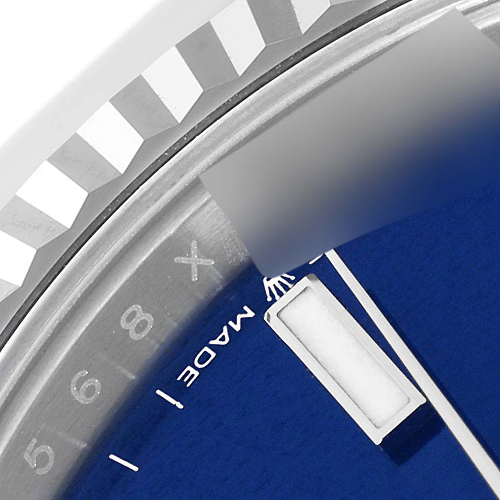 This close-up of the Rolex Datejust 41 126334 Men's Stainless Steel Blue Dial 126334 Men's Stainless Steel Blue Dial watch shows a portion of the dial, bezel, and hour marker.