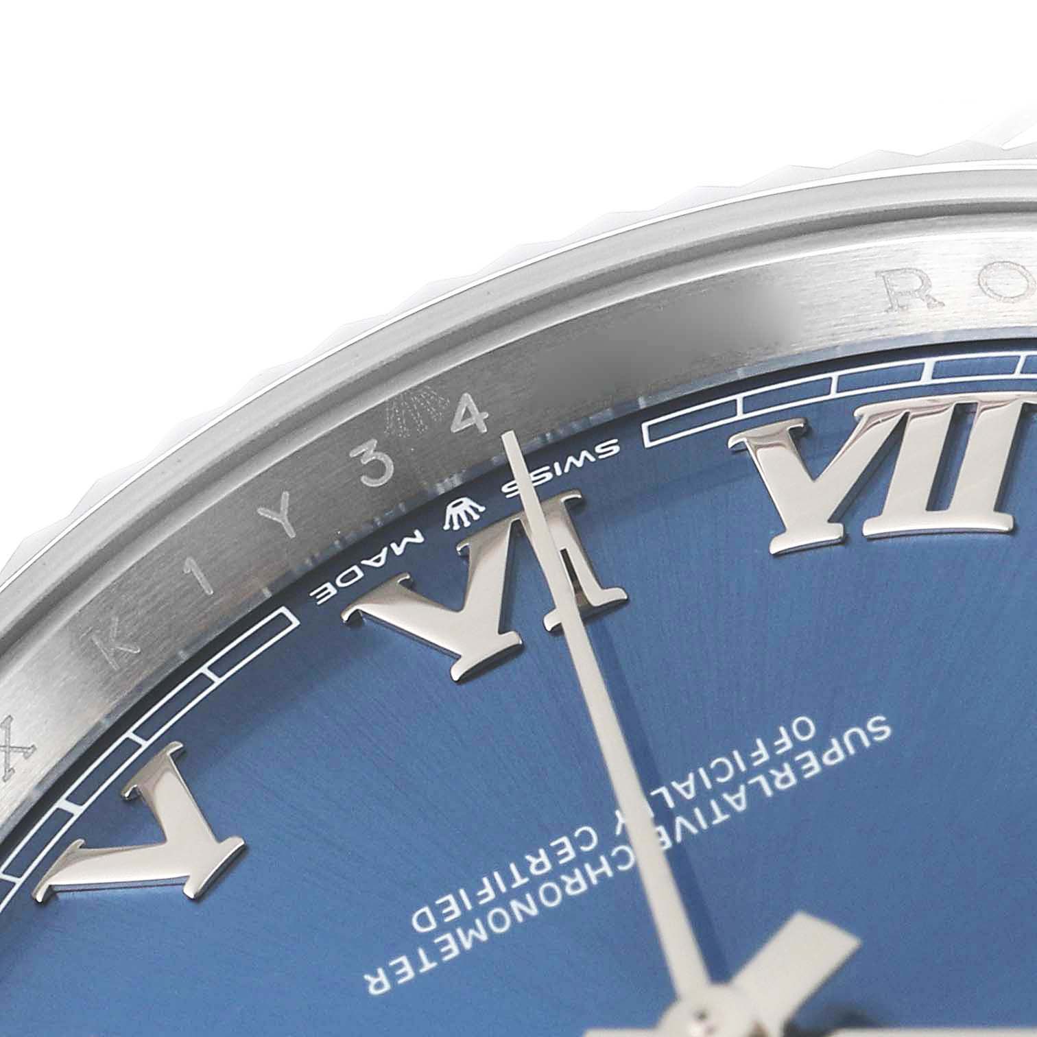 This close-up shows the dial and part of the bezel of the Rolex Datejust 41 126334 Men
s Stainless Steel Blue Dial 126334 Men
s Stainless Steel Blue Dial, featuring Roman numerals and the engraved rehaut.