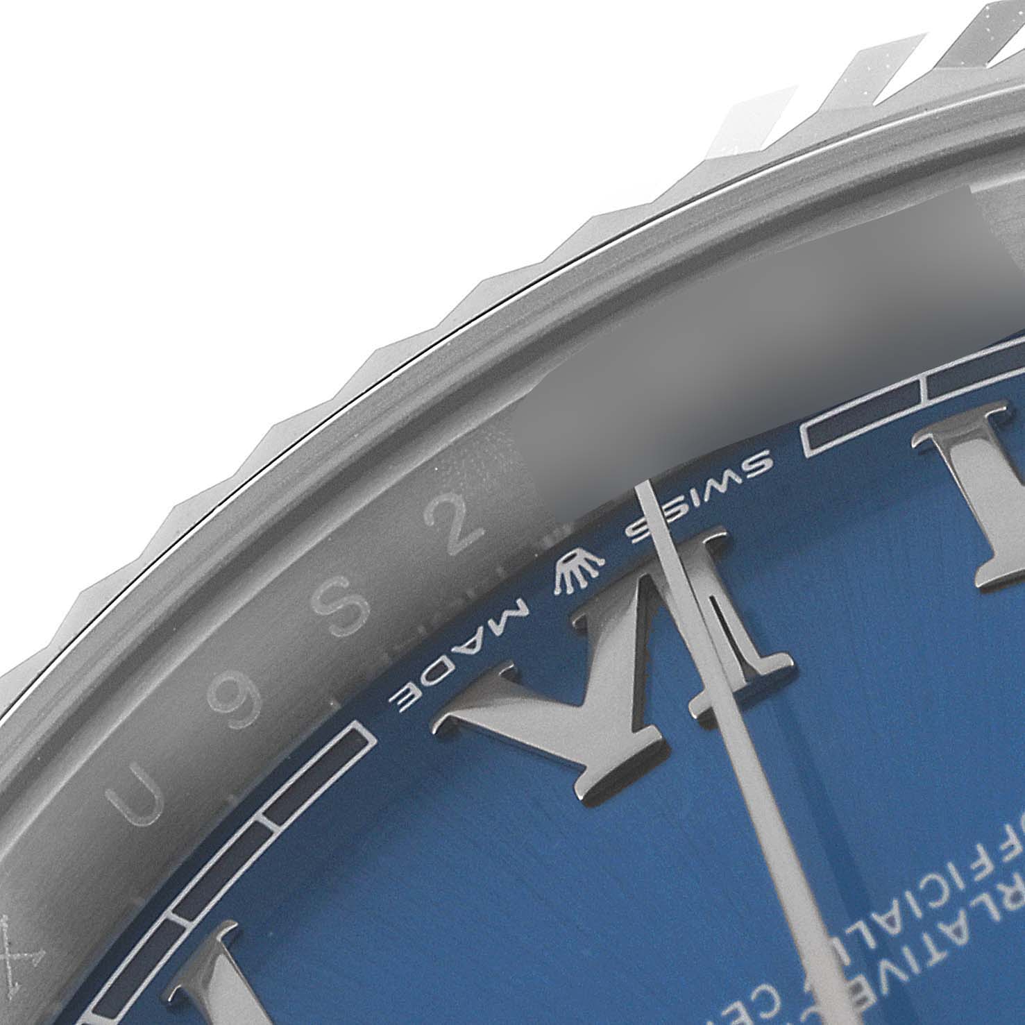 This close-up of the Rolex Datejust 41 126334 Men
s Stainless Steel Blue Dial 126334 Men
s Stainless Steel Blue Dial shows its bezel, part of the blue dial, and hour markers.