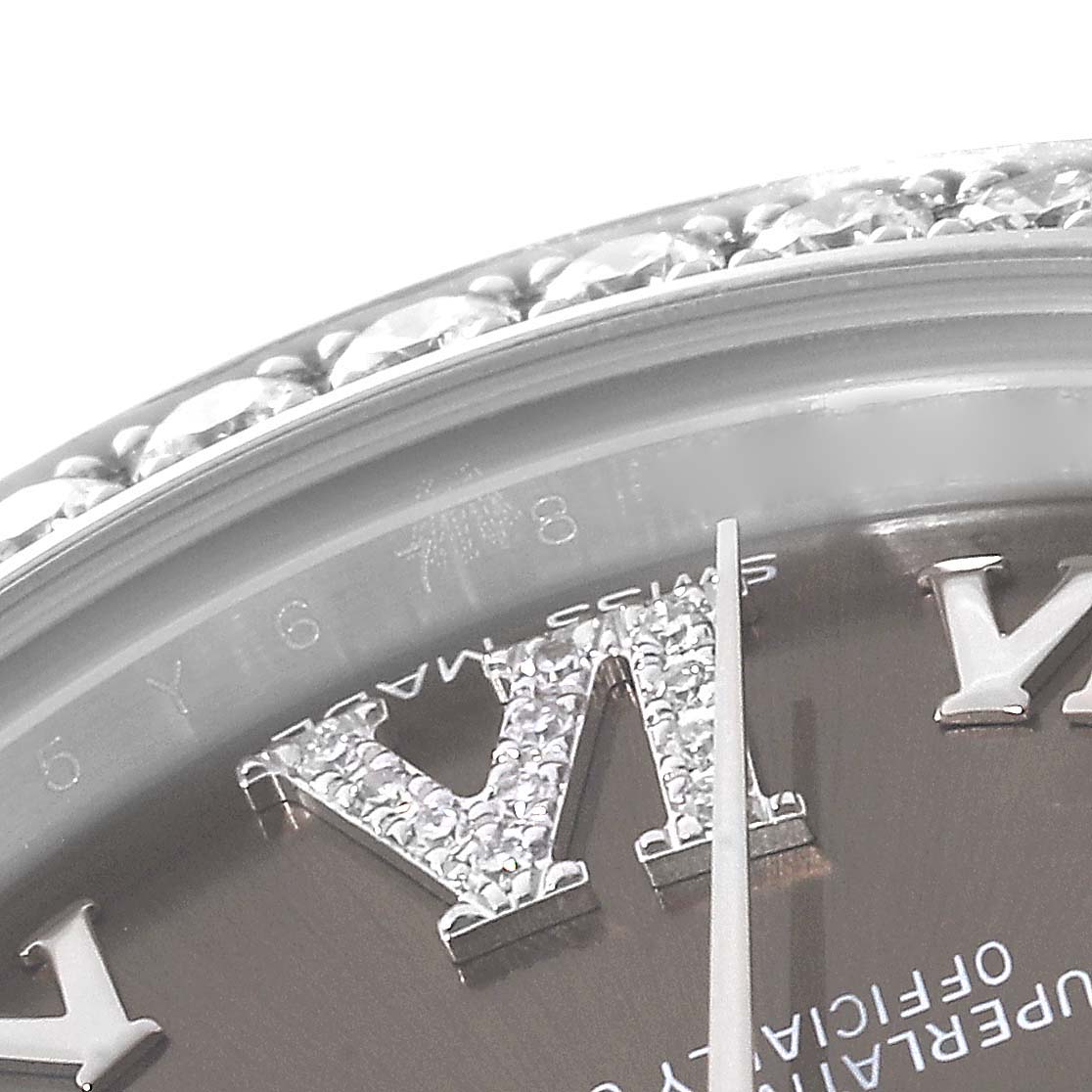 This close-up image shows the diamond-studded Roman numeral hour markers and bezel of a Rolex Mid-Size 178384 Women's Stainless Steel Brown Dial 178384 Women's Stainless Steel Brown Dial watch.